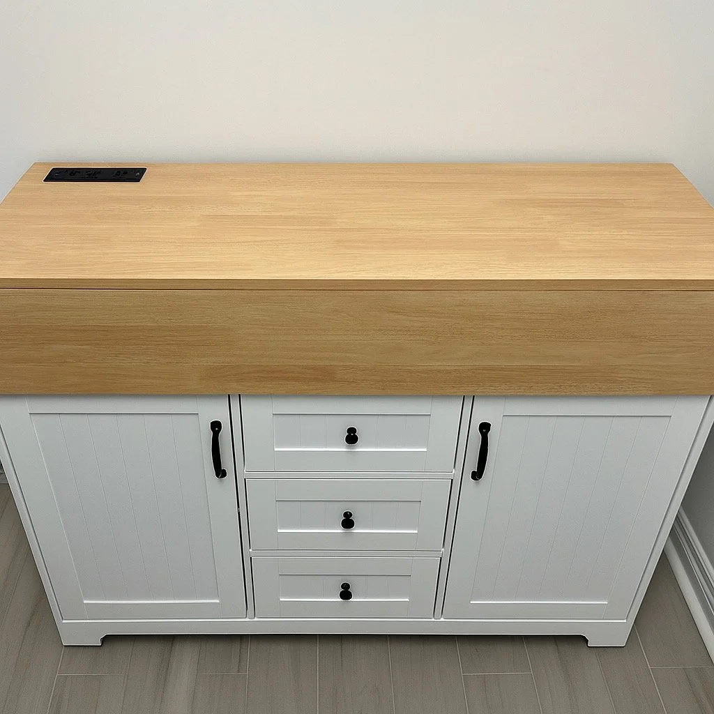 A white cabinet with three drawers and two doors, topped with a light wood counter, is positioned against a plain white wall.