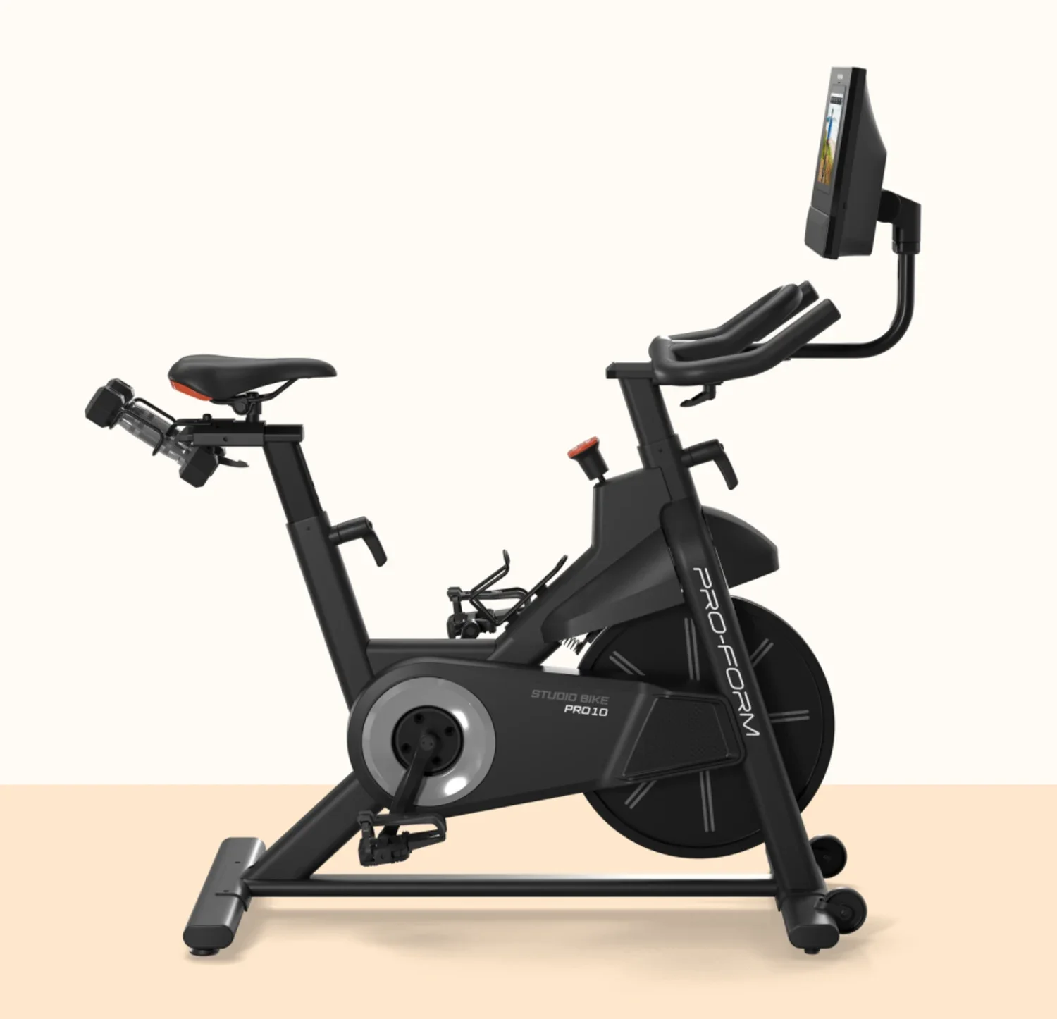 A black stationary exercise bike with digital display, adjustable seat, and handlebars, placed on a two-tone beige background.