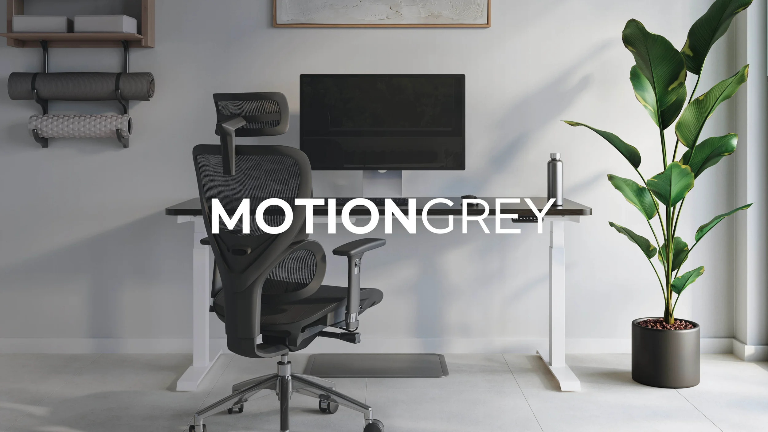 Home office with a black ergonomic chair, a white desk with a computer monitor, a water bottle, a potted plant, and wall-mounted storage with rolled yoga mats.