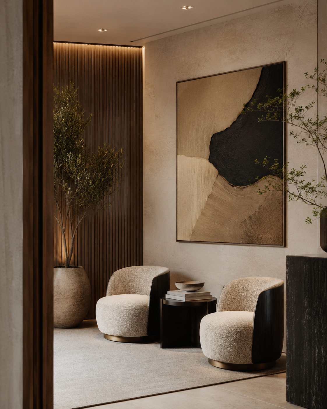 Modern luxury waiting room with oversized wall art, sculptural seating and warm architectural finishes.