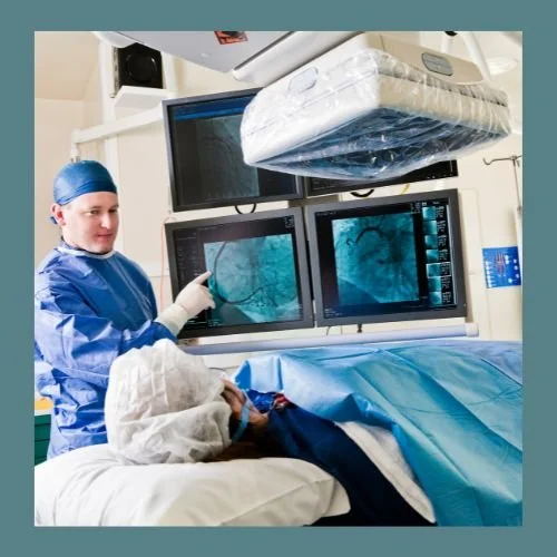 Surgeon in operating room talking with patient on the table