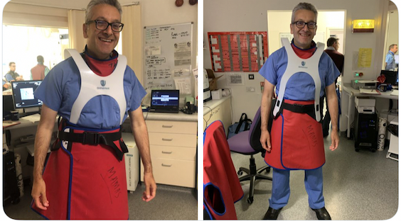 Physician smiling and wearing a two piece lead apron with OrthoVest
