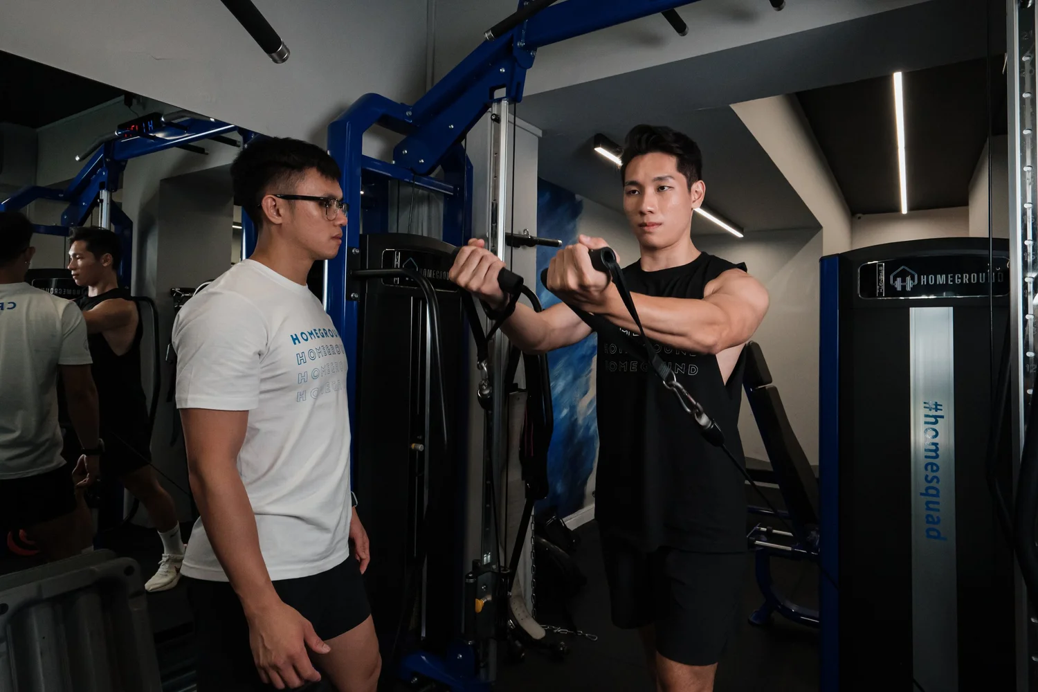 Homeground personal trainer coaching a client