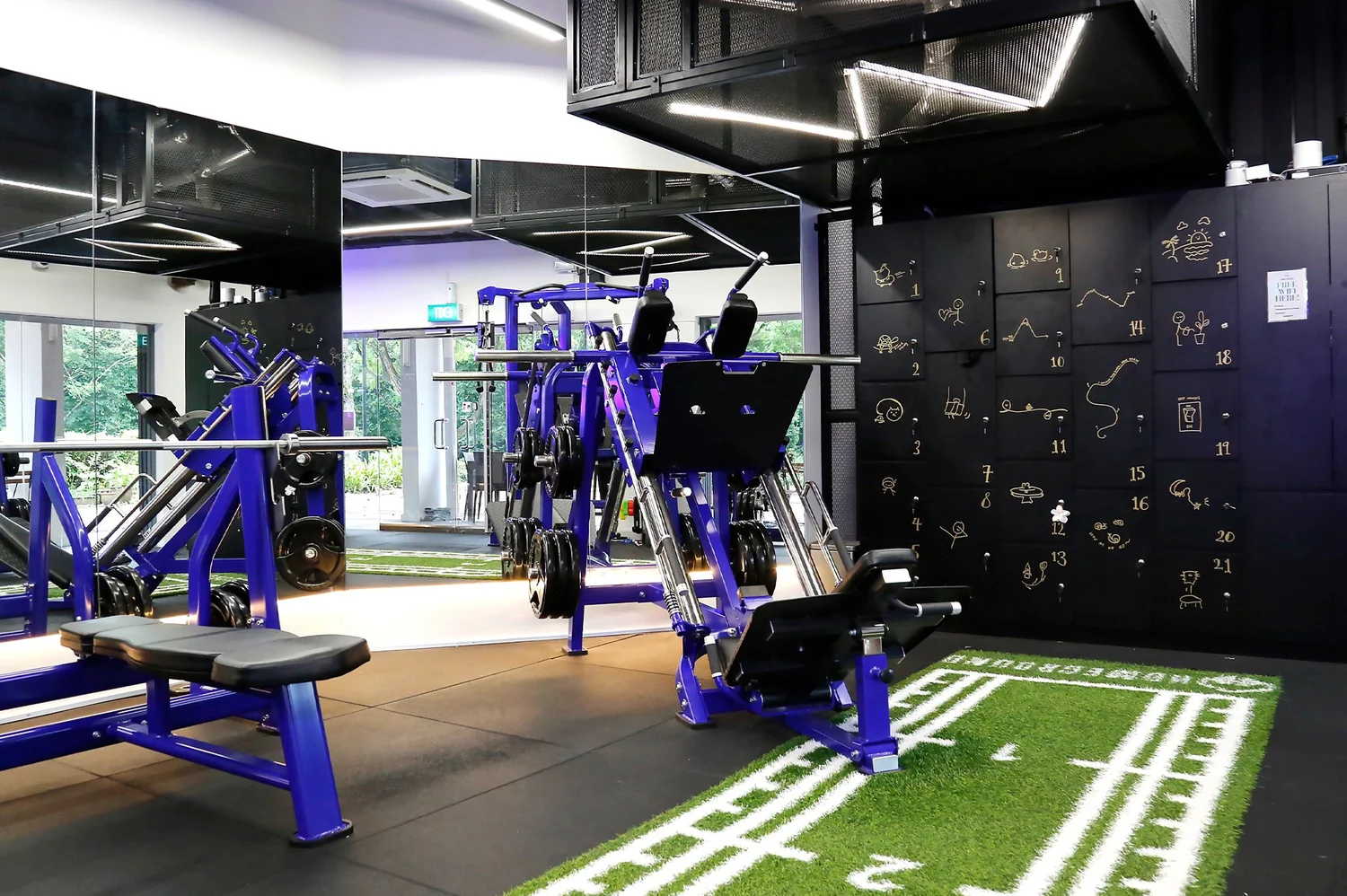 Homeground Gym trainer coaching a client on the leg press at Clementi