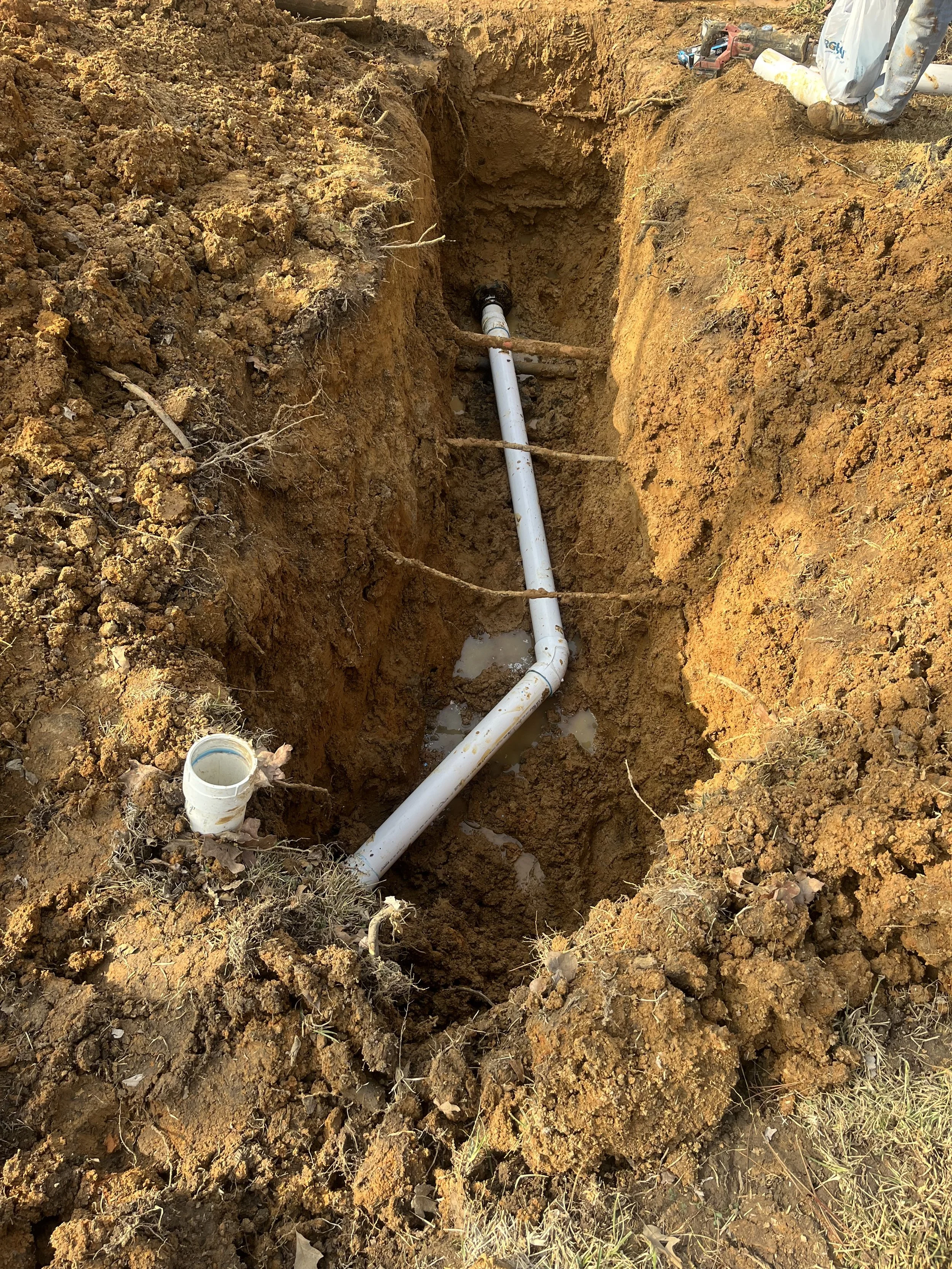 Logo for Champagne Plumbing Co with the letters CPC in a circle and the tagline "Refined Service. Reliable Results."