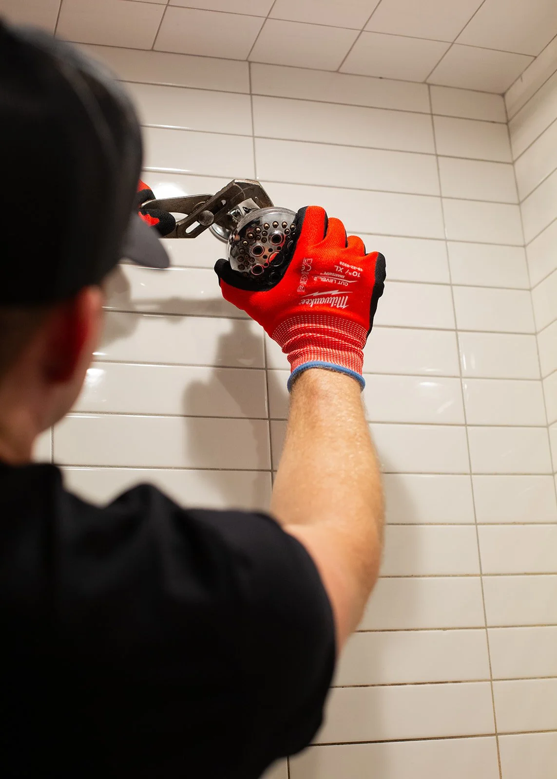 Logo of Champagne Plumbing Co with the initials 'CPC' in large letters and the company name below, along with the slogan 'Refined Service. Reliable Results.' in gold text on a black background.