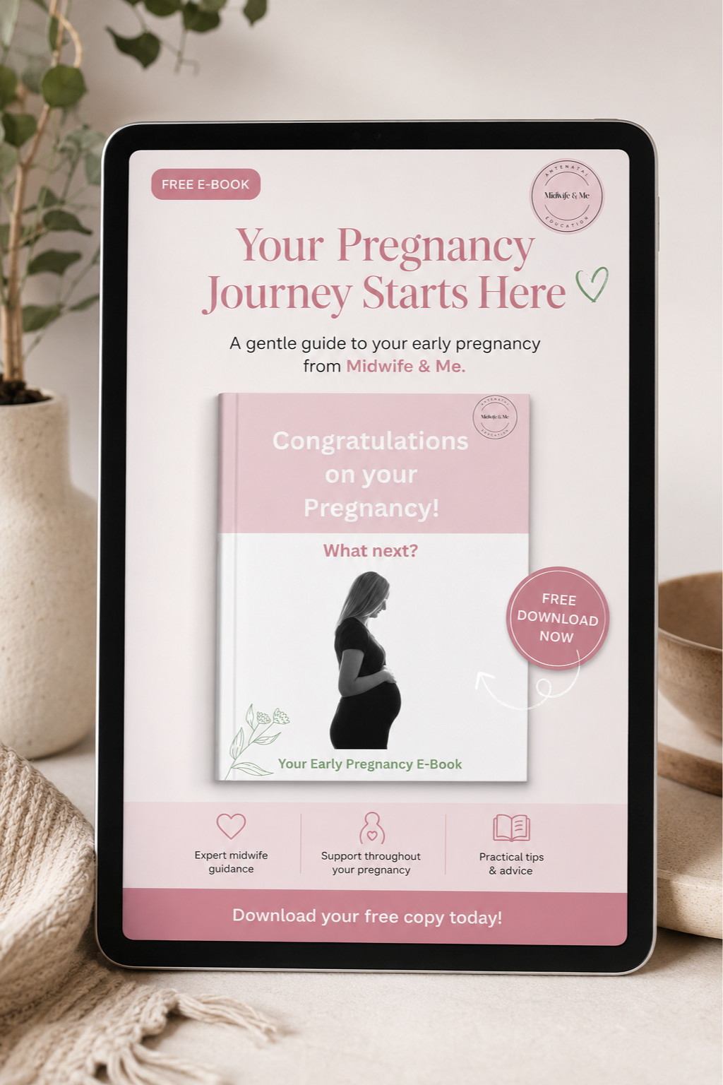 An iPad displaying a pink and white e-book cover titled "Your Pregnancy Journey Starts Here" by Midwife & Me, with a silhouette of a pregnant woman, surrounded by text about early pregnancy guidance, free download, and tips, set in a cozy environment with a plant and pottery in the background.