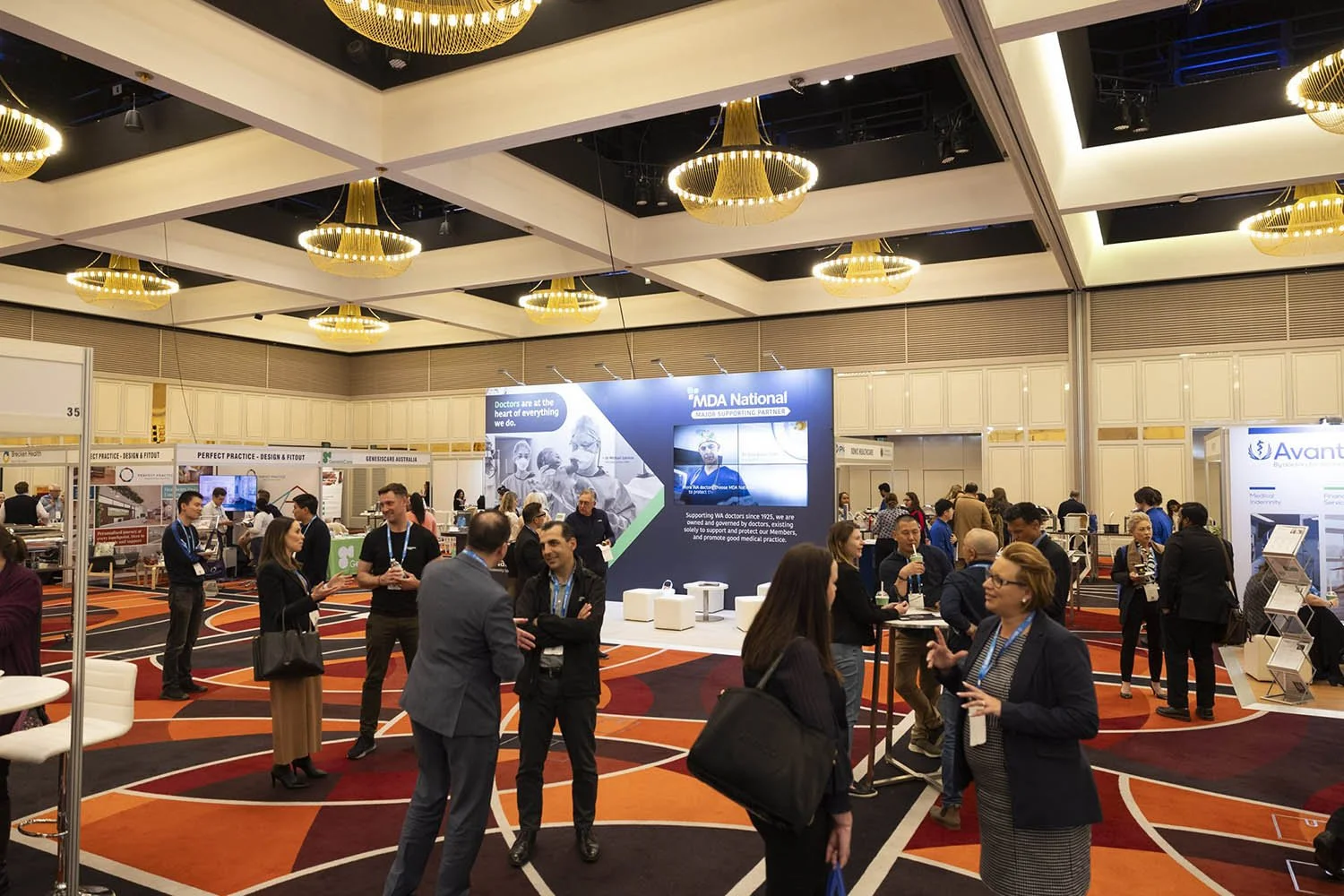 Delegates networking and visiting exhibitor booths at MedCon 2023 conference in Perth.