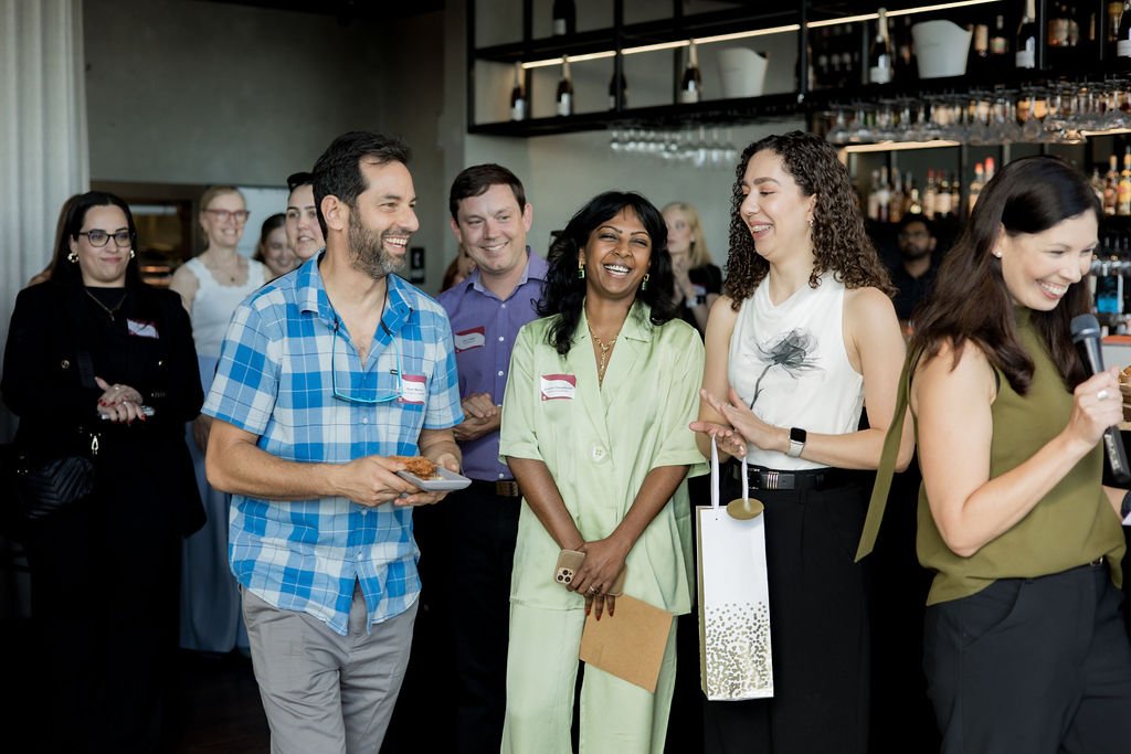 Guests laughing and enjoying prize giveaways during the Elevated Connections networking evening hosted by Event & Conference Co. in Perth.