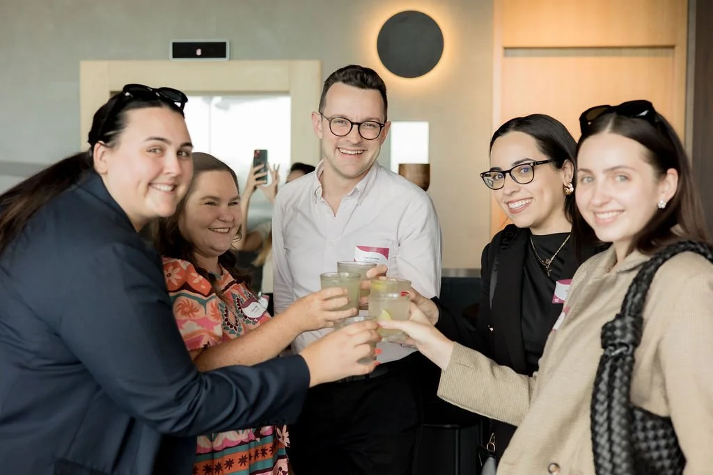 Group of guests smiling and toasting with cocktails at Event & Conference Co.’s Elevated Connections networking event in Perth.