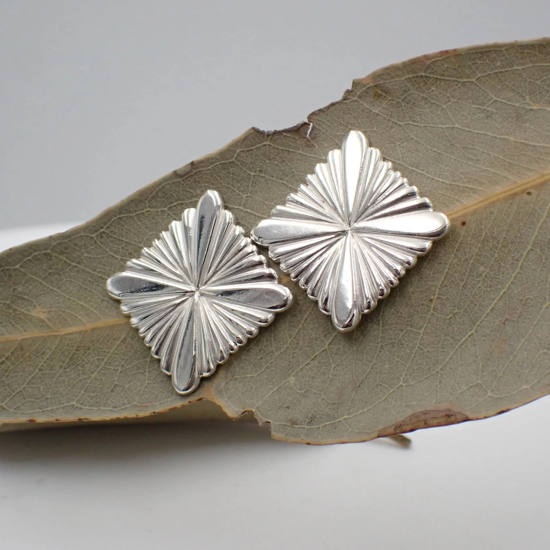 Quad+Radient+Silver+Studs+4.jpg