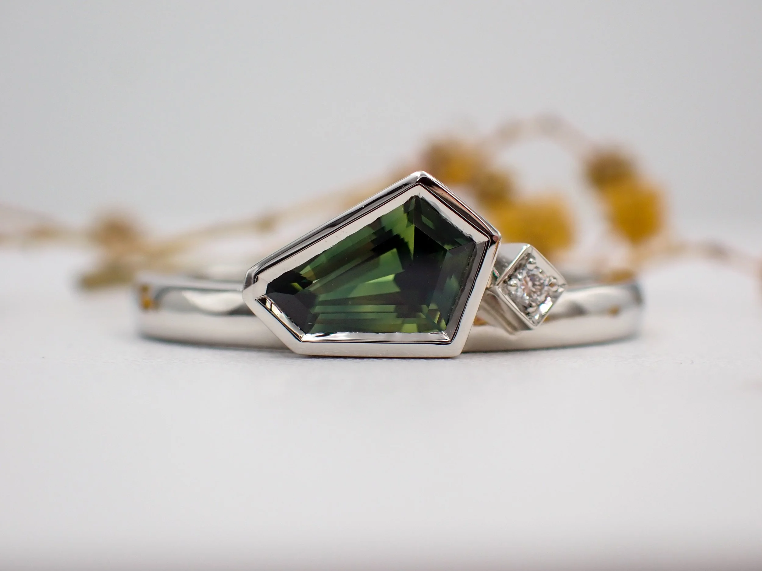 Freeform green sapphire ring with diamond.jpg