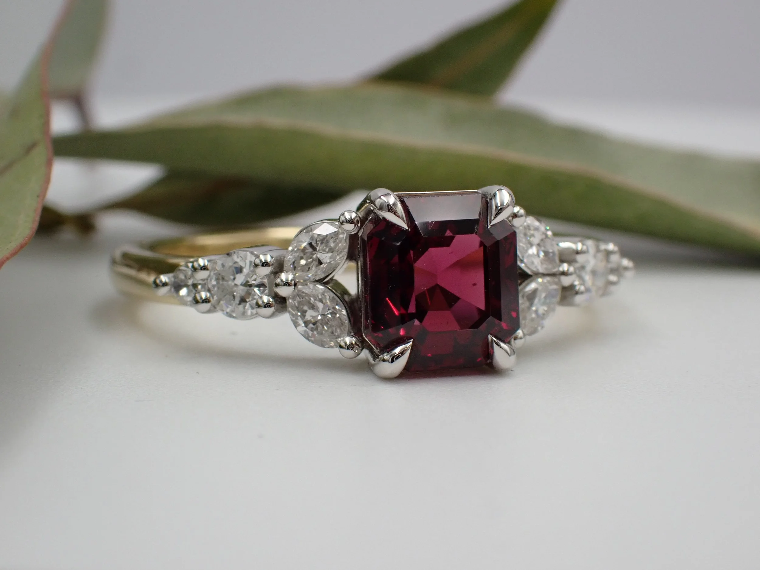 Four Claw Set Garnet with half diamond band 