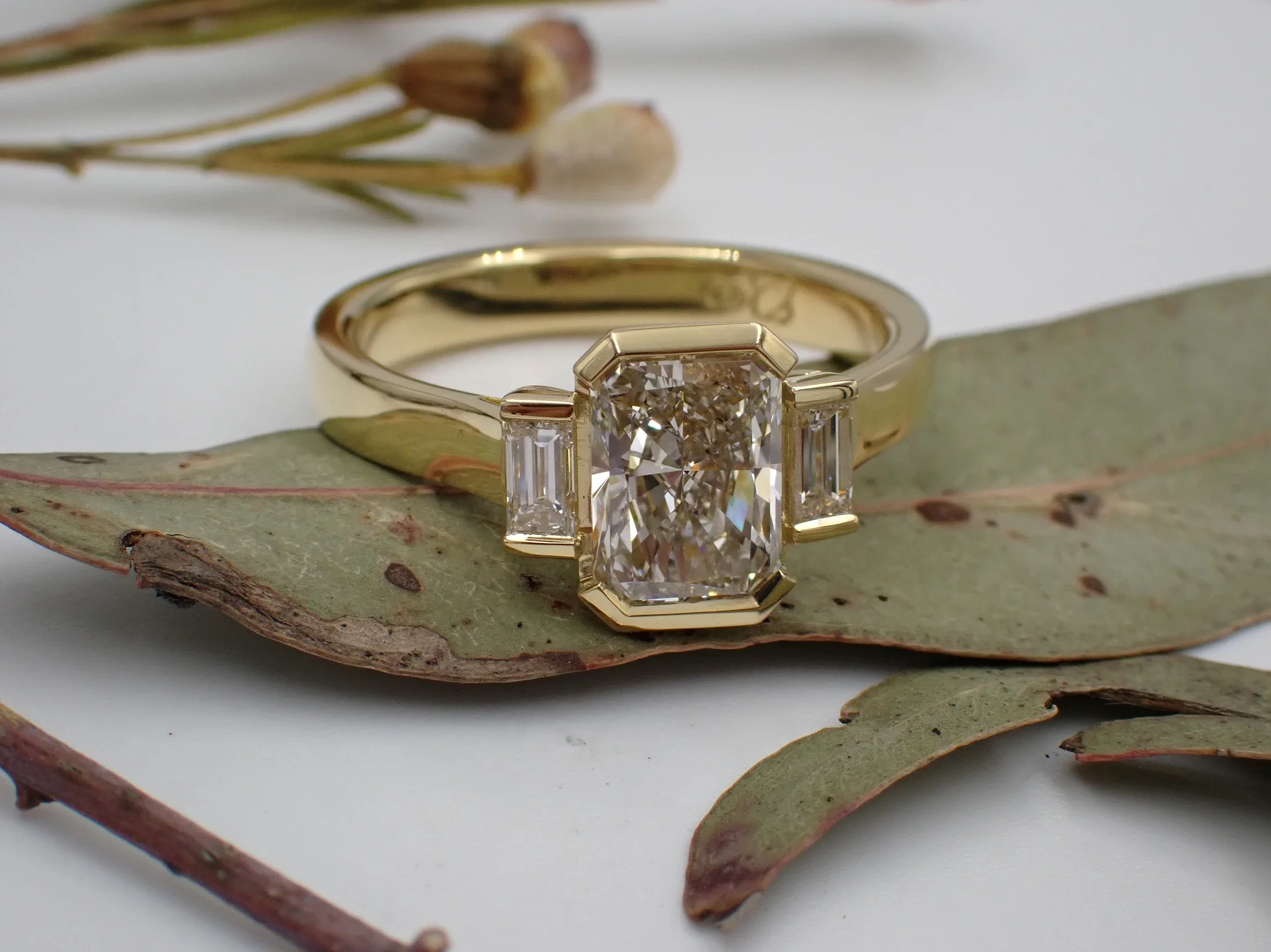 Three stone Diamond Engagement ring on a gold band