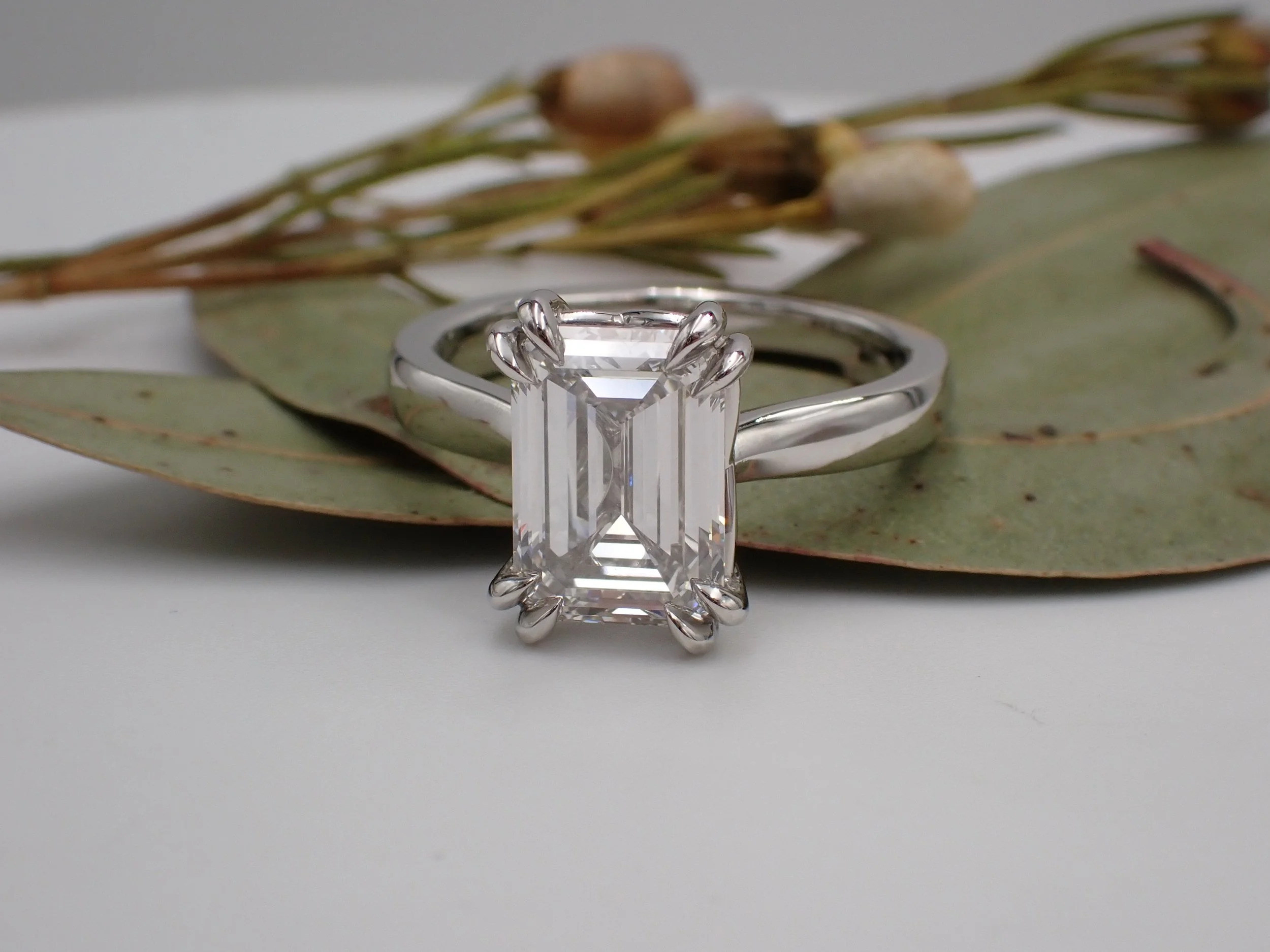 Emerald cut diamond solitaire ring.JPG