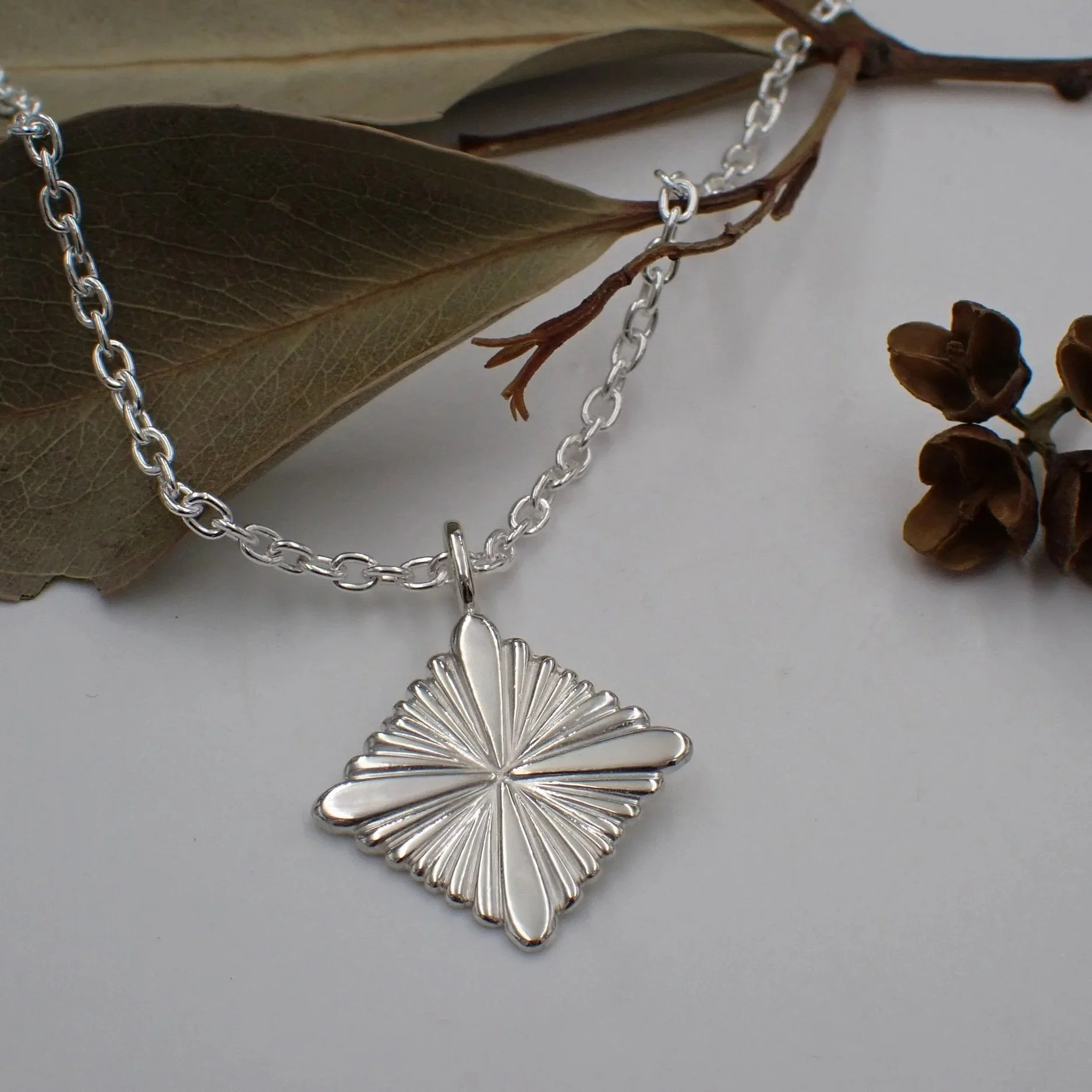 Quad+sunburst+Silver+Pendent+1.jpg