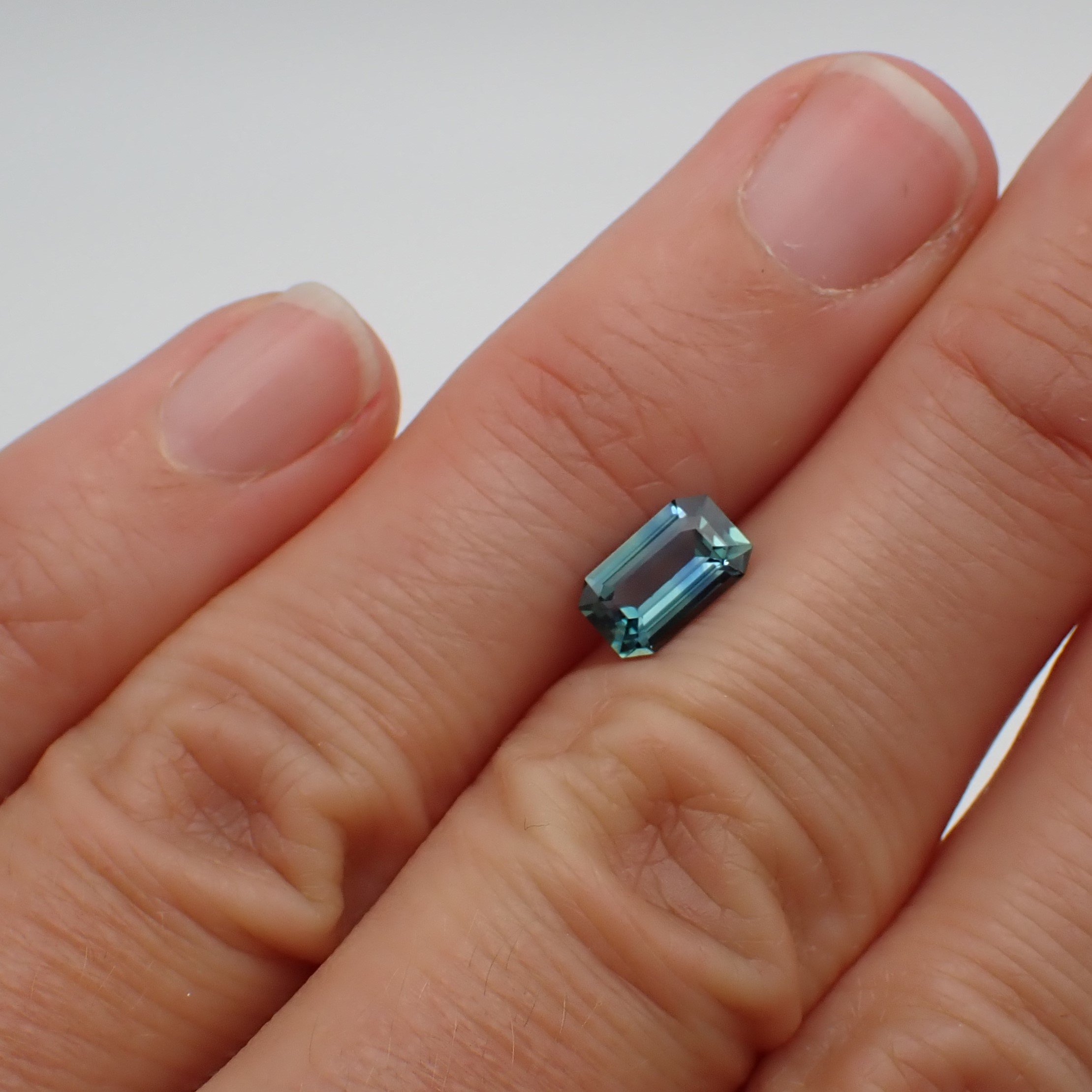 madagascar-teal-sapphire-emerald-cut-1.11ct-scale.JPG