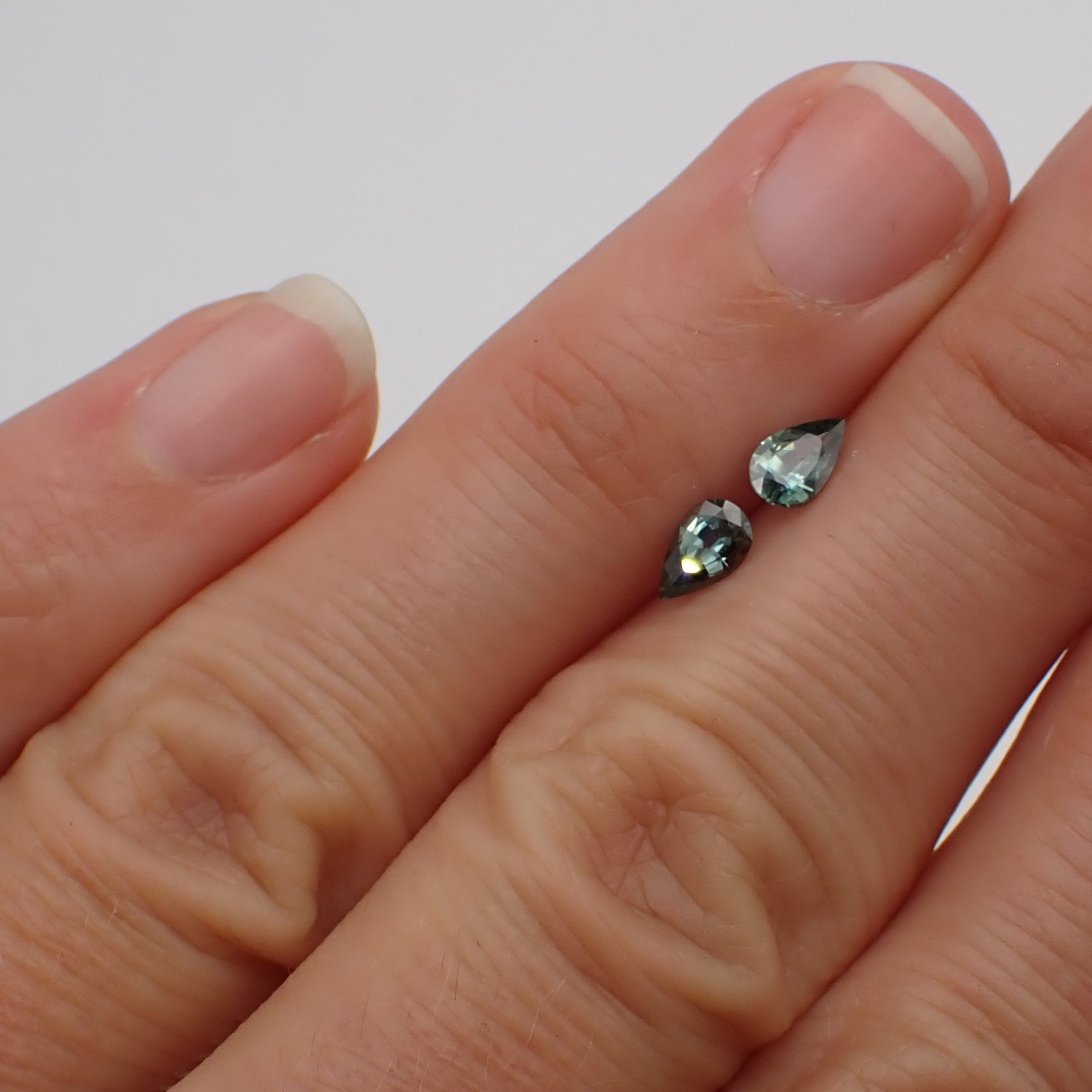 sri-lankan-teal-sapphire-pair-pear cut-0.58ct-scale.JPG