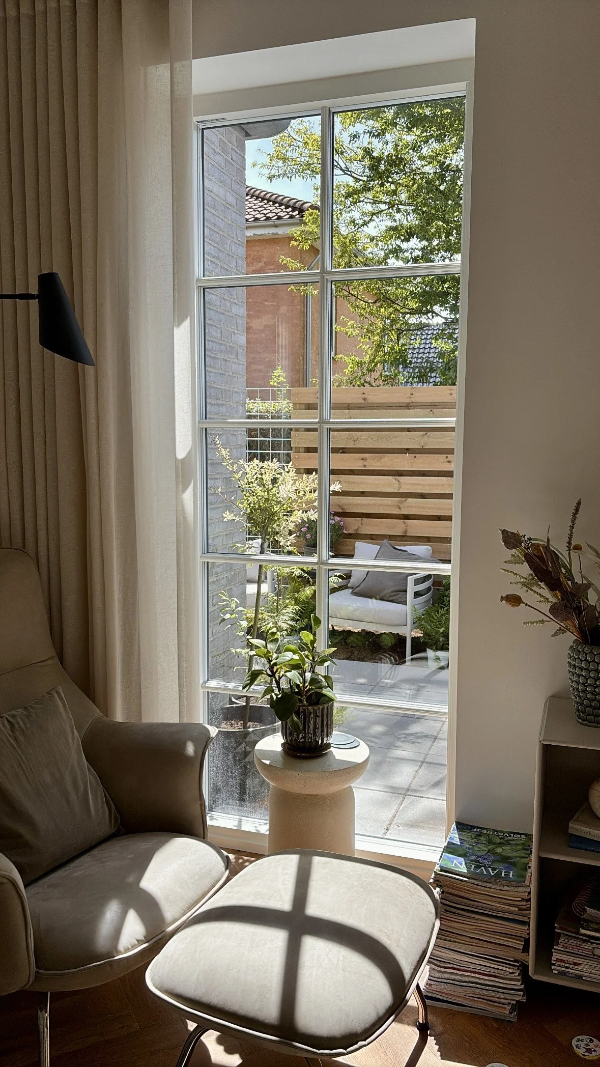 Before and after transformation of a newbuild garden, showing how an unfinished outdoor space can be turned into a calm, functional garden in just one season.