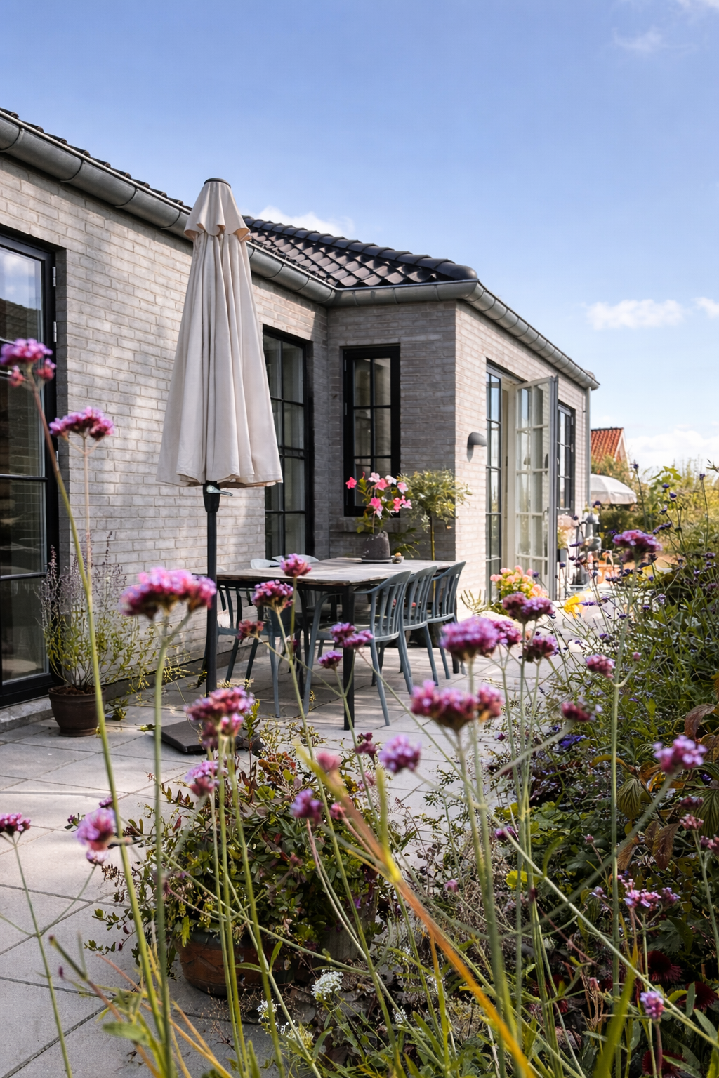 Before and after transformation of a newbuild garden, showing how an unfinished outdoor space can be turned into a calm, functional garden in just one season.