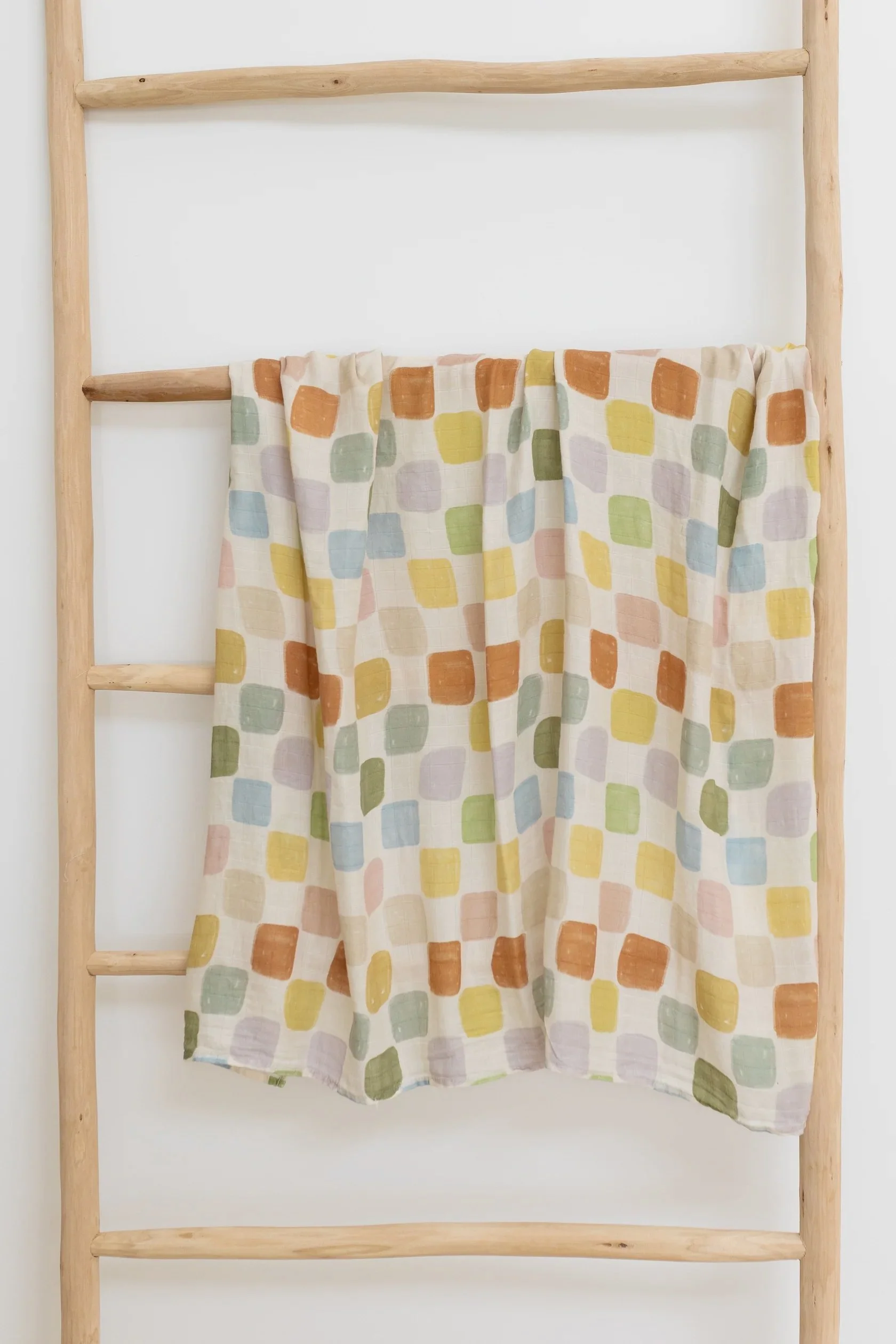 rainbow-nest-baby.swaddle.coco-&-len-posies-en-pointe.jpg.jpg