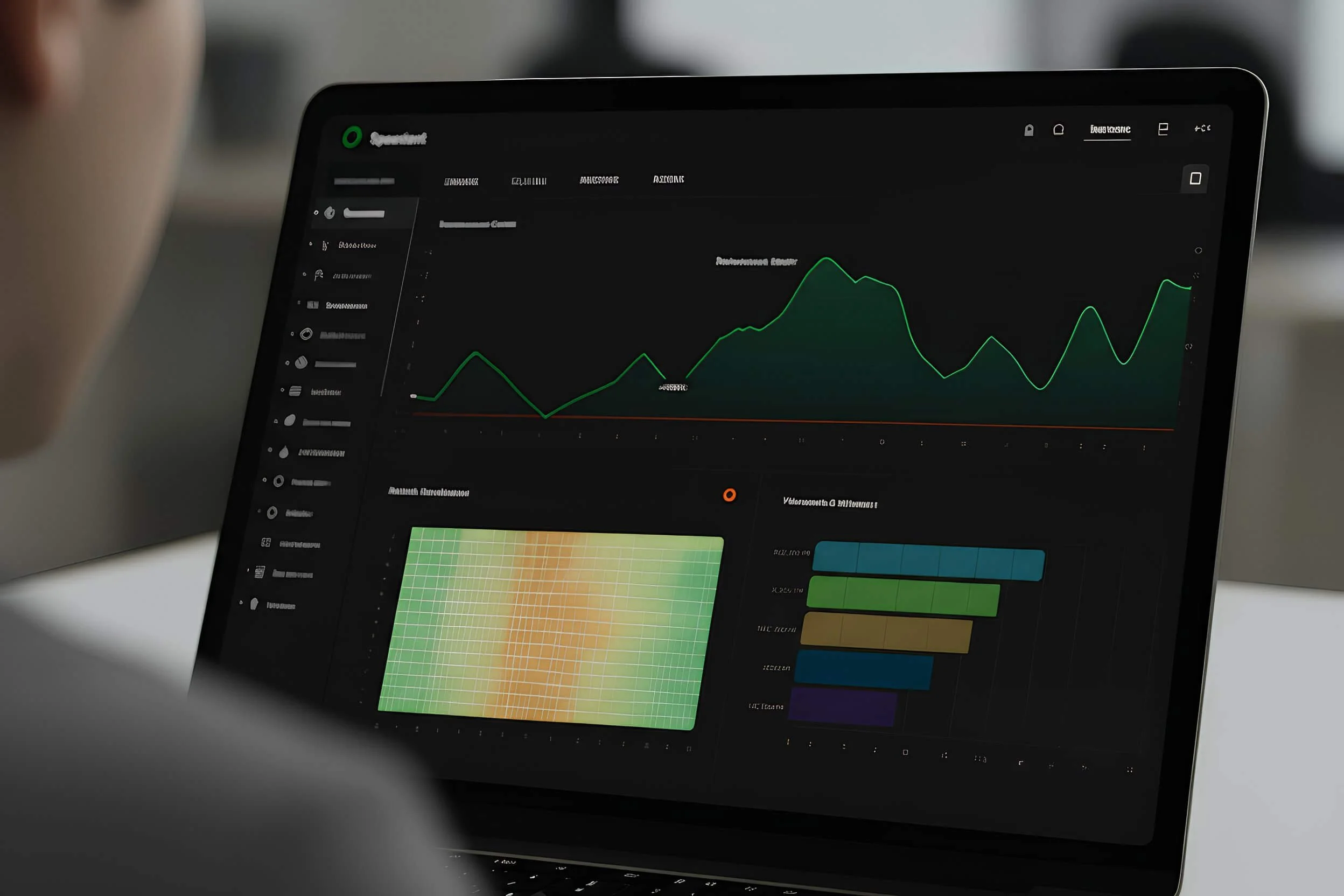 Close-up of a tablet showing a data analytics dashboard with a line graph and color-coded heatmap.