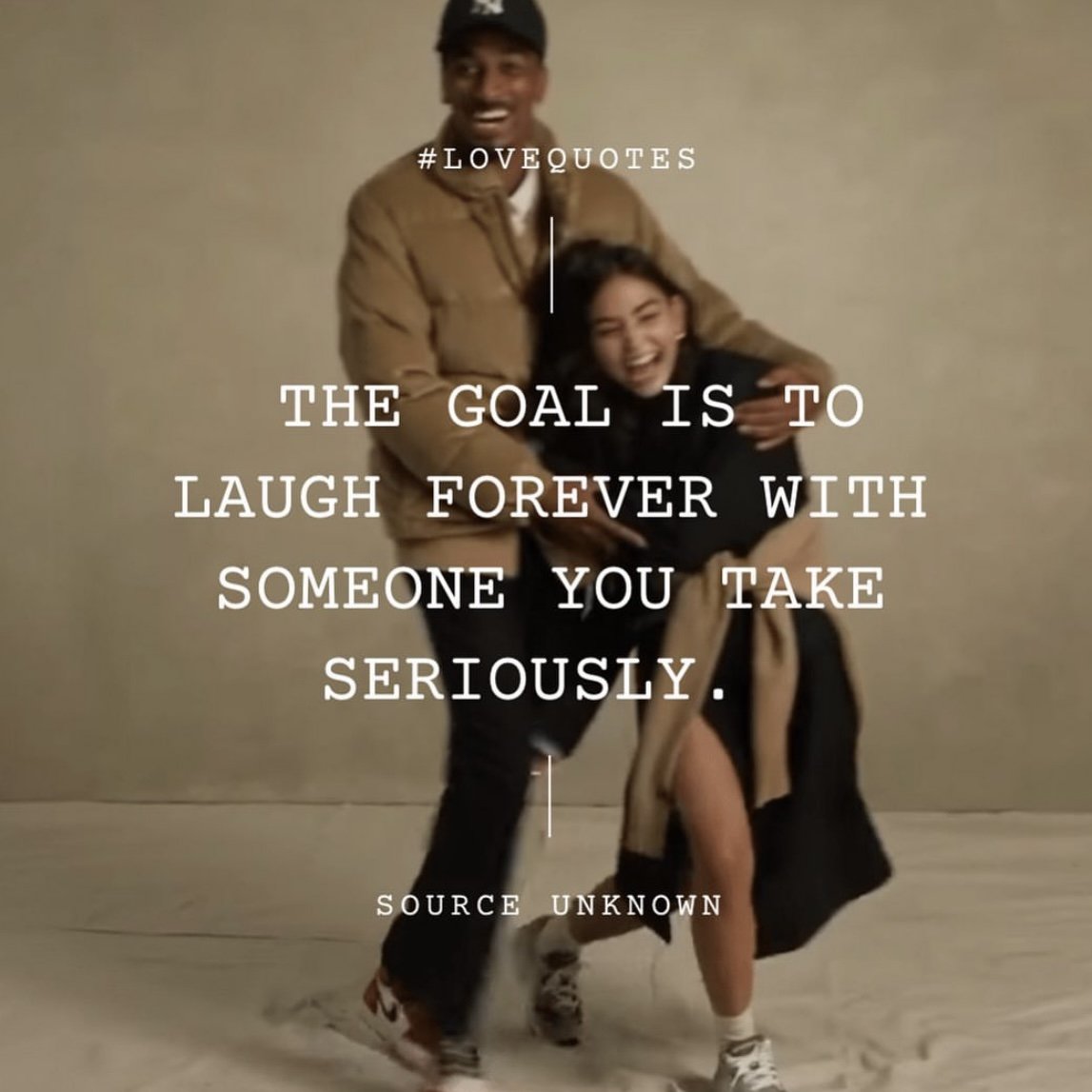 A smiling man and woman are laughing and hugging each other. The woman has a coat draped over her shoulder, and both are dressed casually. The background is plain. Overlaid text reads, '#LOVEQUOTES THE GOAL IS TO LAUGH FOREVER WITH SOMEONE YOU TAKE S