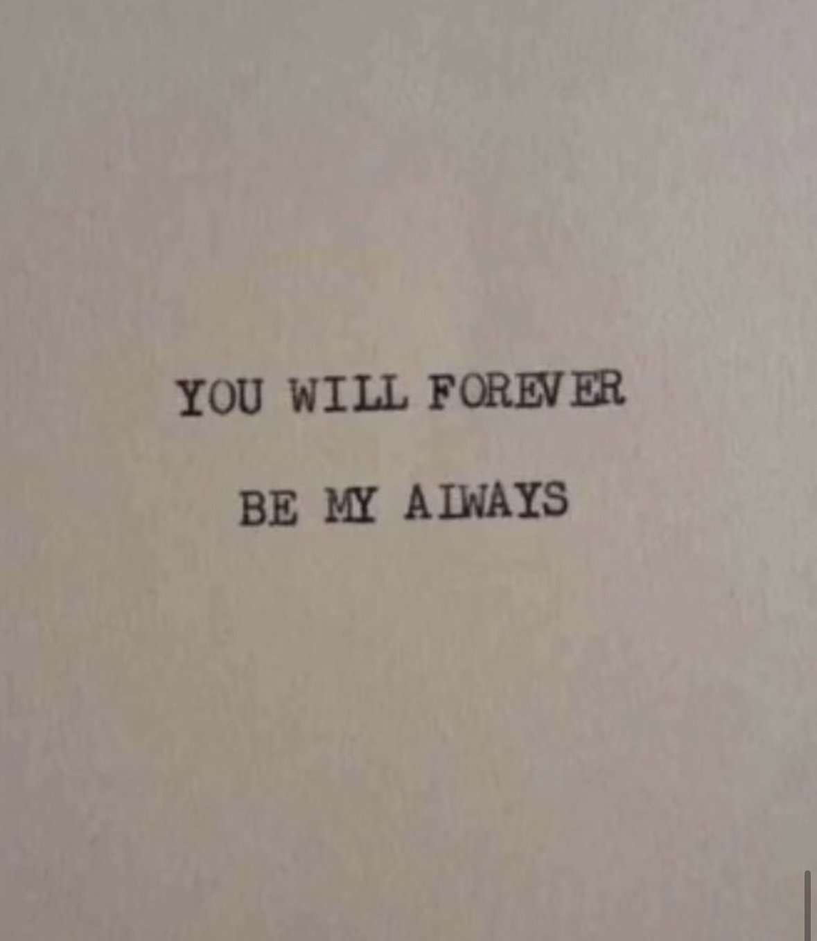 A piece of paper with the words "You will forever be my always" typed in black text.