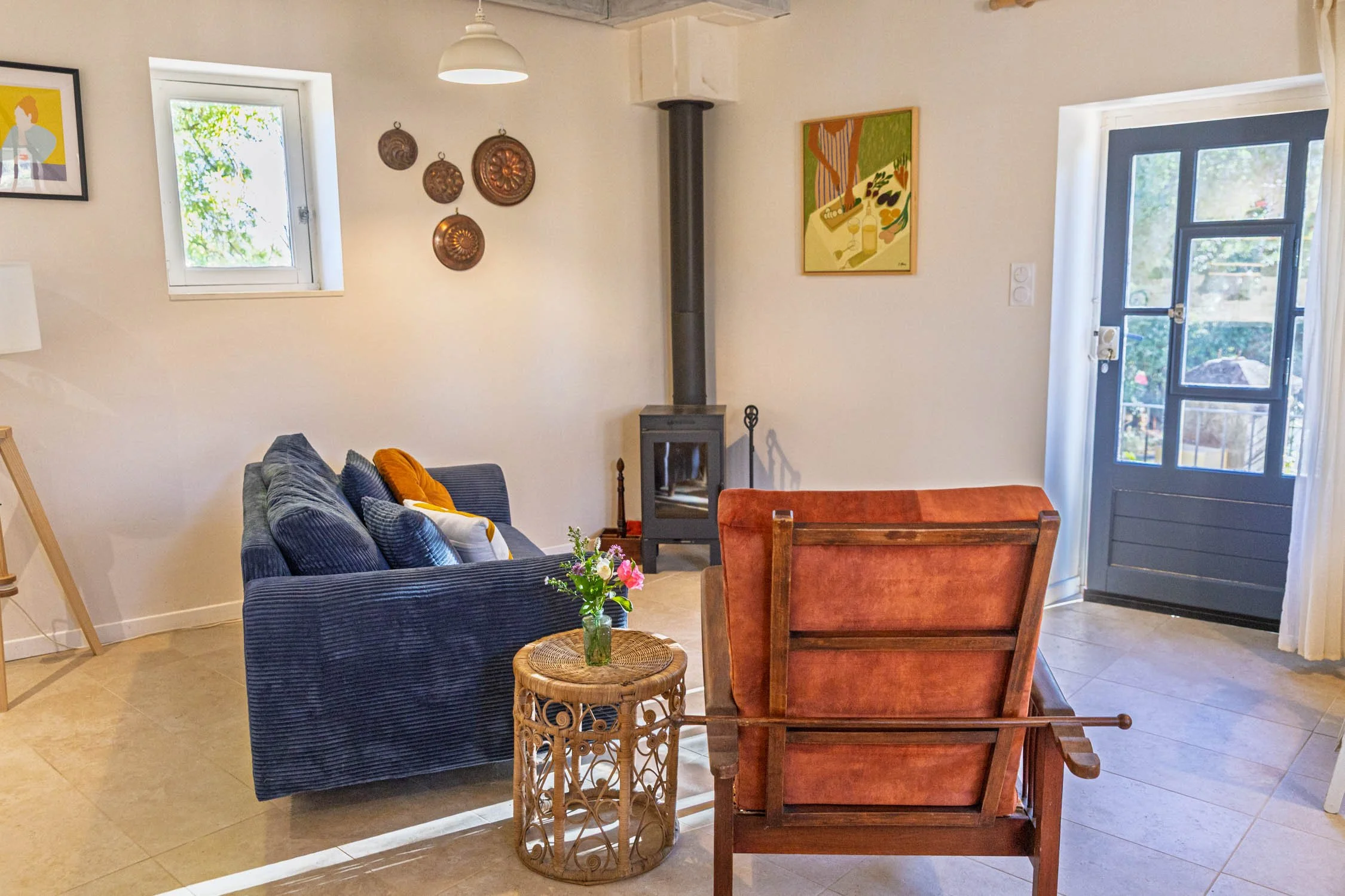 A cozy living room with a wood burning stove