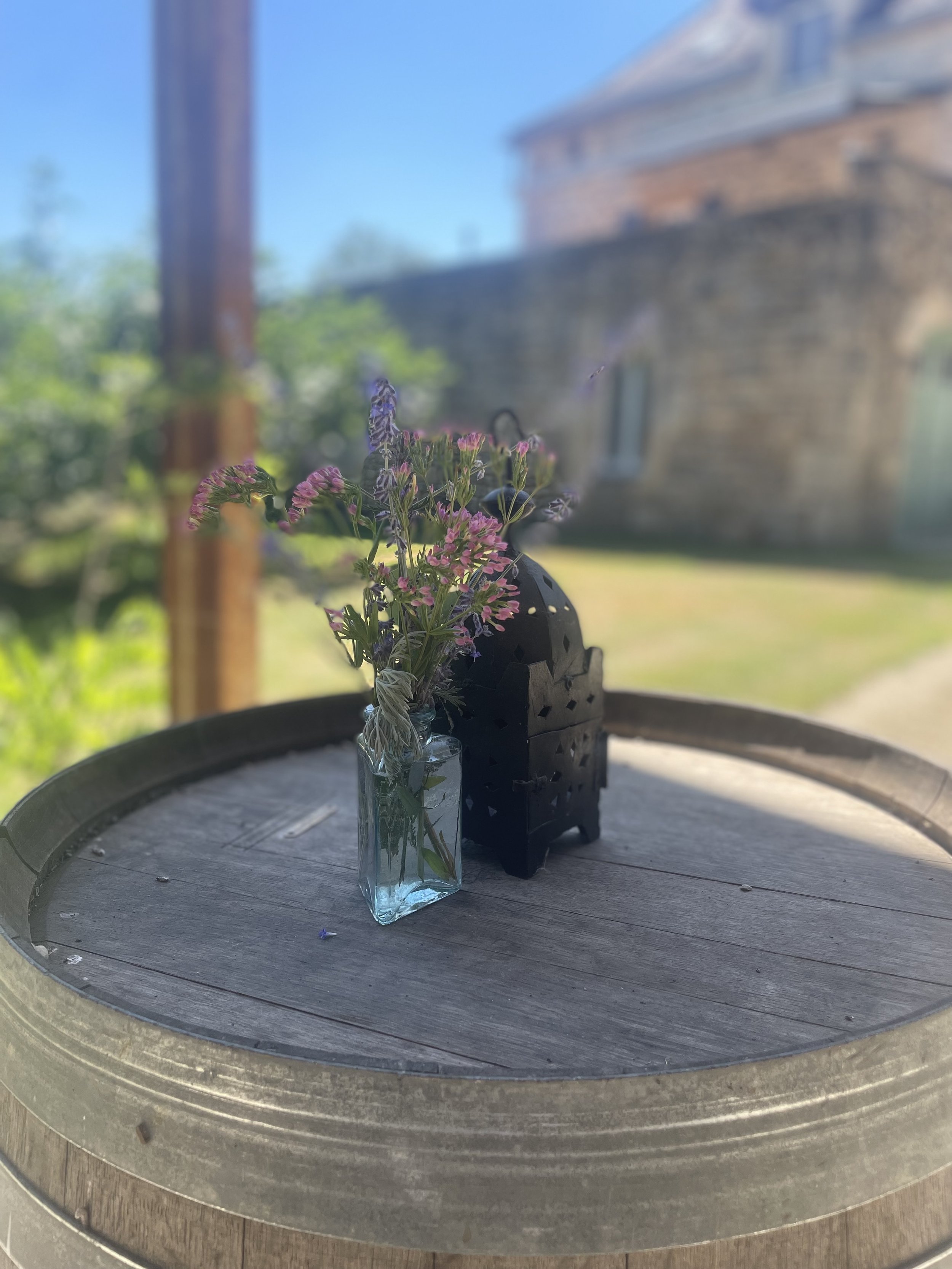 Flowers and candles on a barrel