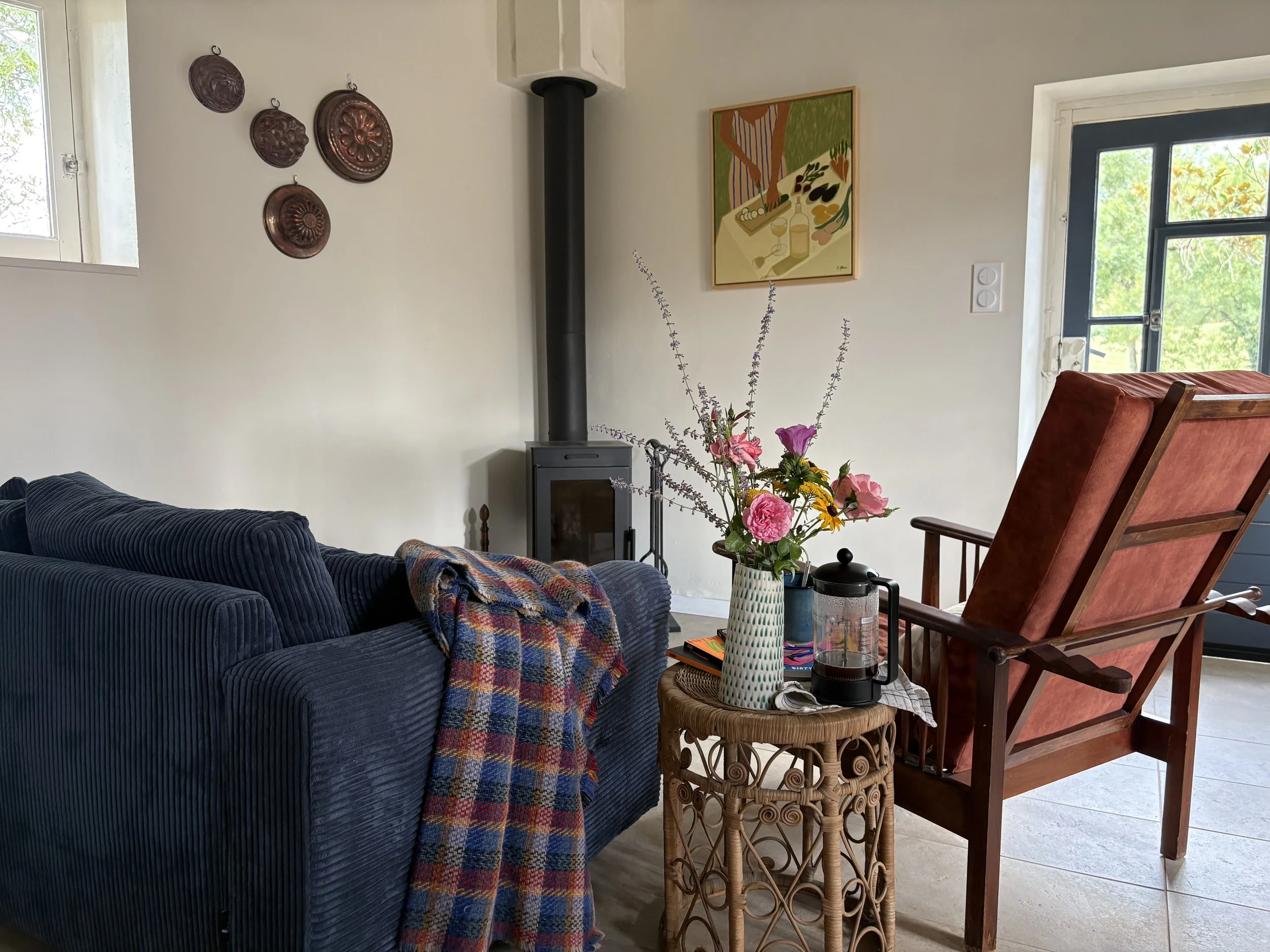 A cozy living room with a wood burning stove