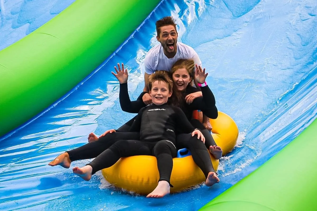 Dad and kids enjoying a family day out at out in Cornwall