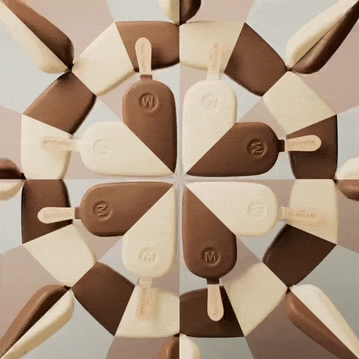 A circular arrangement of chocolate and vanilla popsicles arranged in alternating pattern, viewed from above.