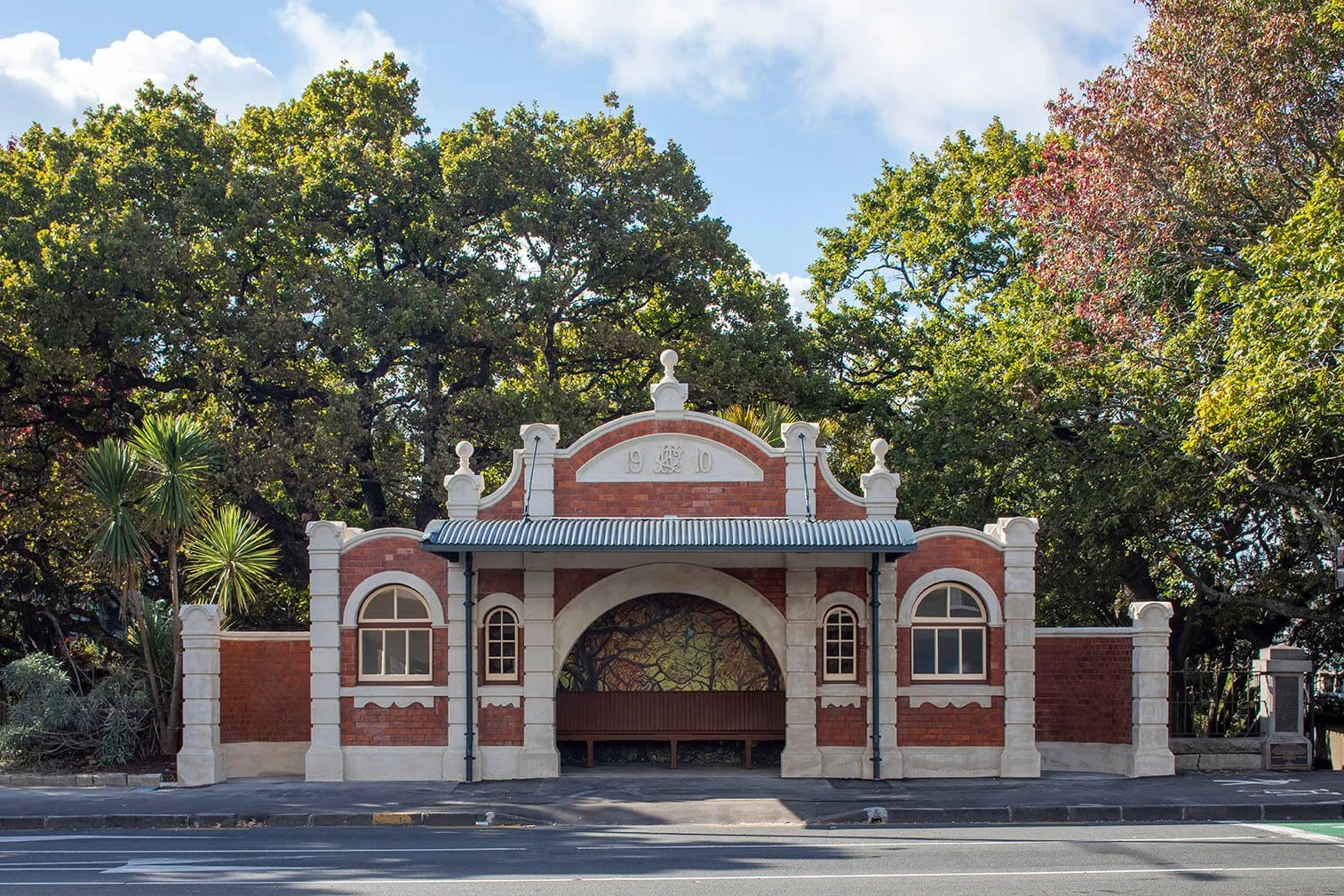 Andrew Plastering full heritage facade restoration of Grafton Bridge Toilets in Auckland during daylight.