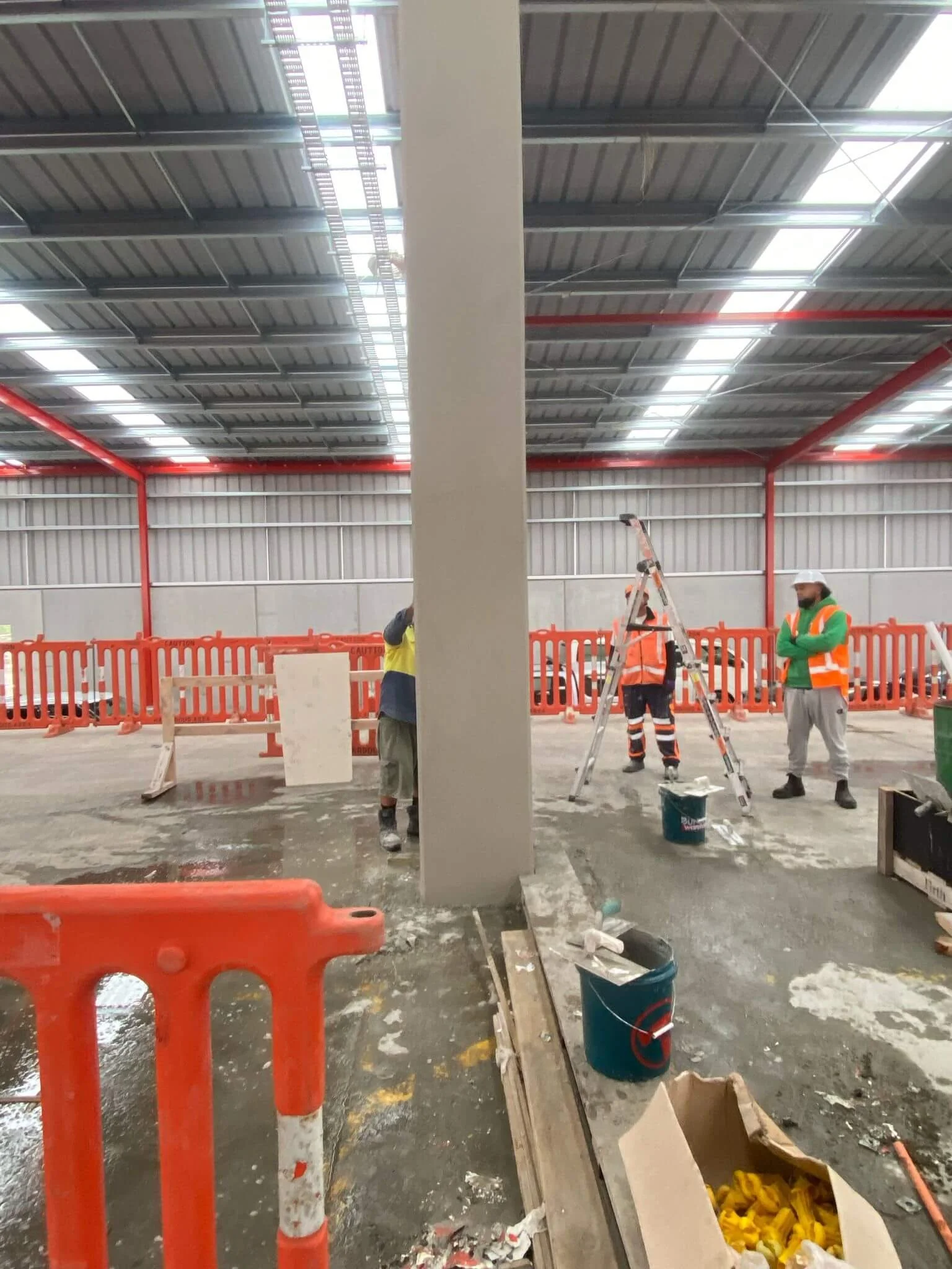 Restored concrete column after Andrew Plastering remedial repair work on construction site.