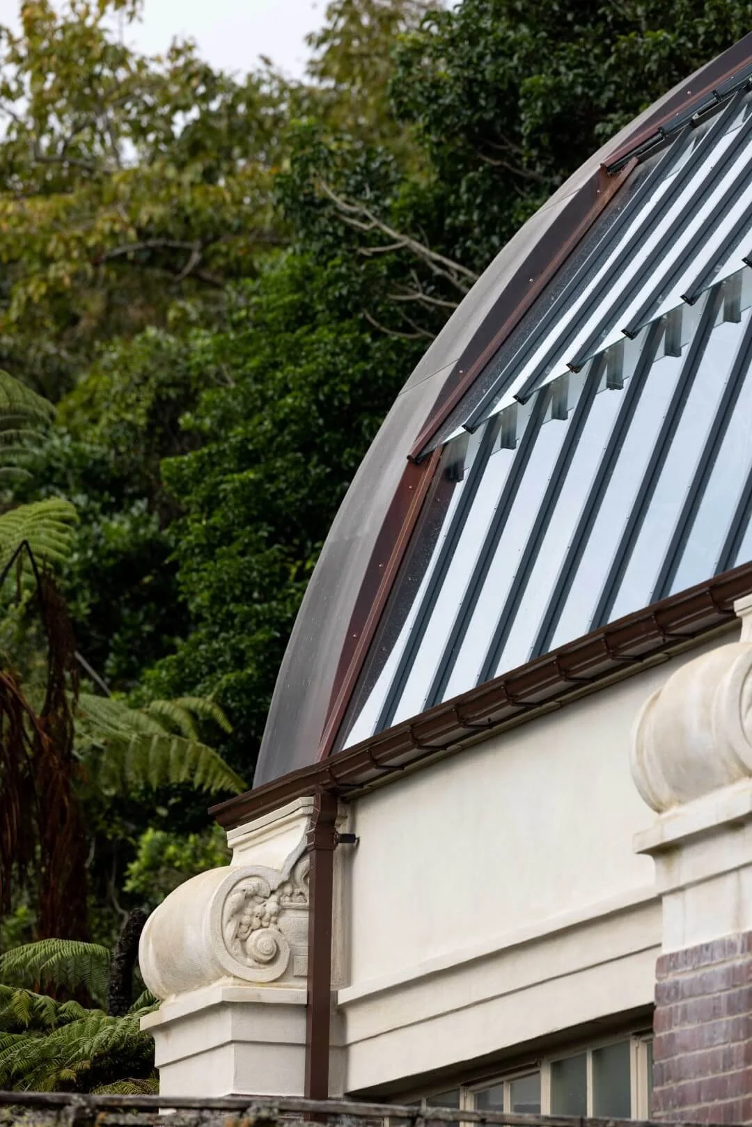 Andrew Plastering heritage restoration on glasshouse facade at Auckland Domain Winter Gardens.