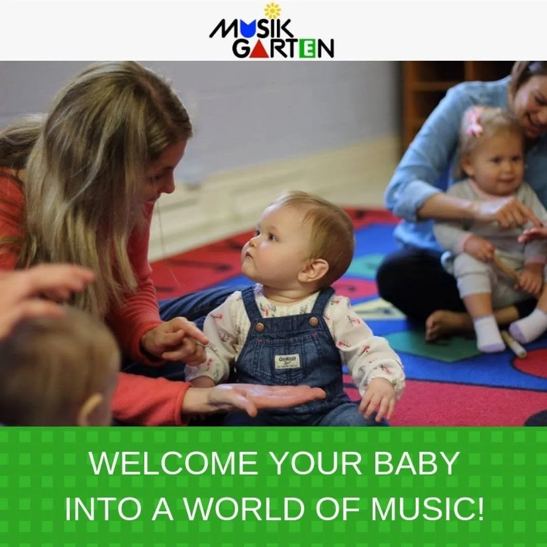 A music-themed children's program with women and small children sitting on colorful mats, interacting with each other, with a message that says 'Welcome your baby into a world of music!'