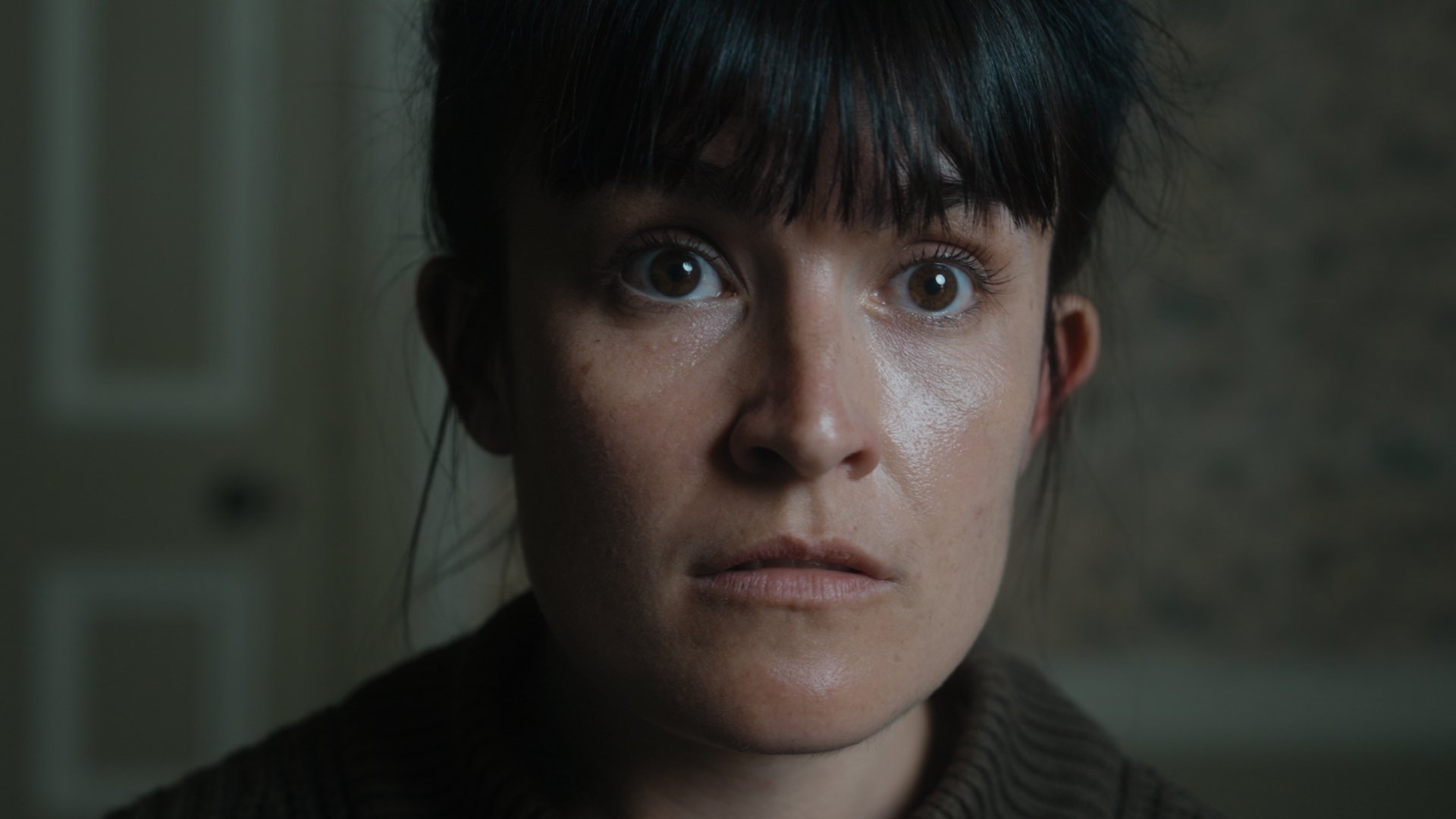 A closeup on a serious woman.
