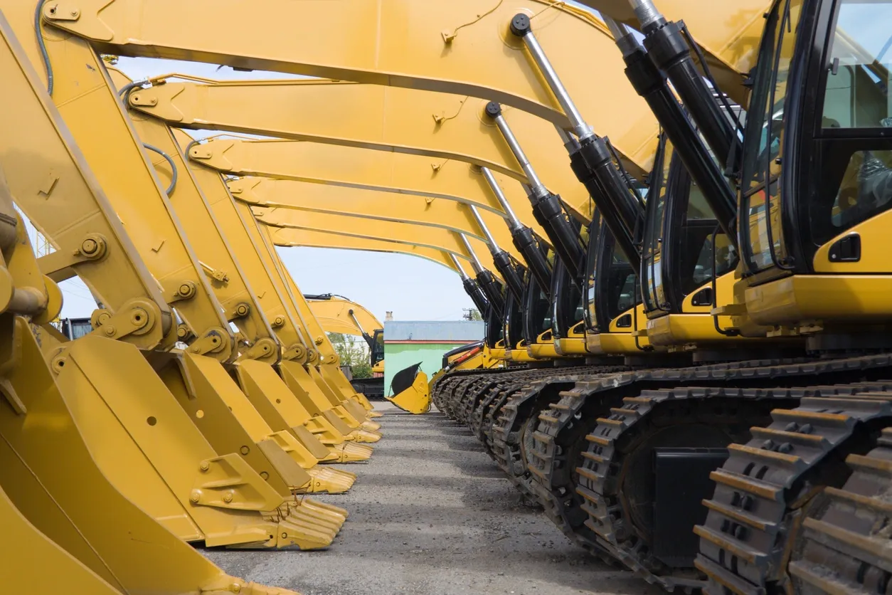 Mobile diesel fitter in Toowoomba - CGK Earth & Ag - Multiple yellow excavators parked back to back on a gravel lot.