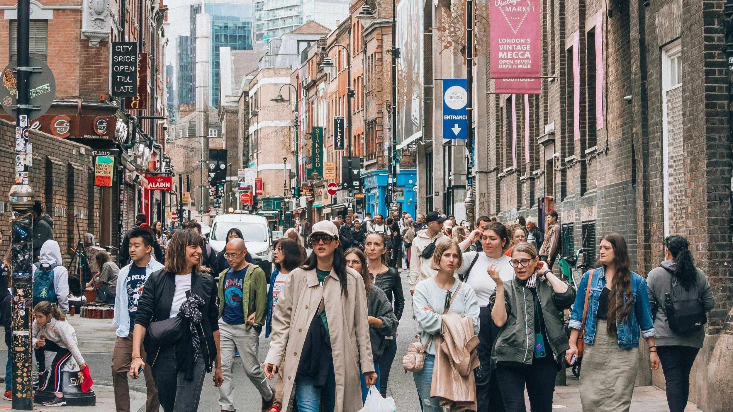 People shopping in Brick Lane, in Shoreditch for vintage clothing.