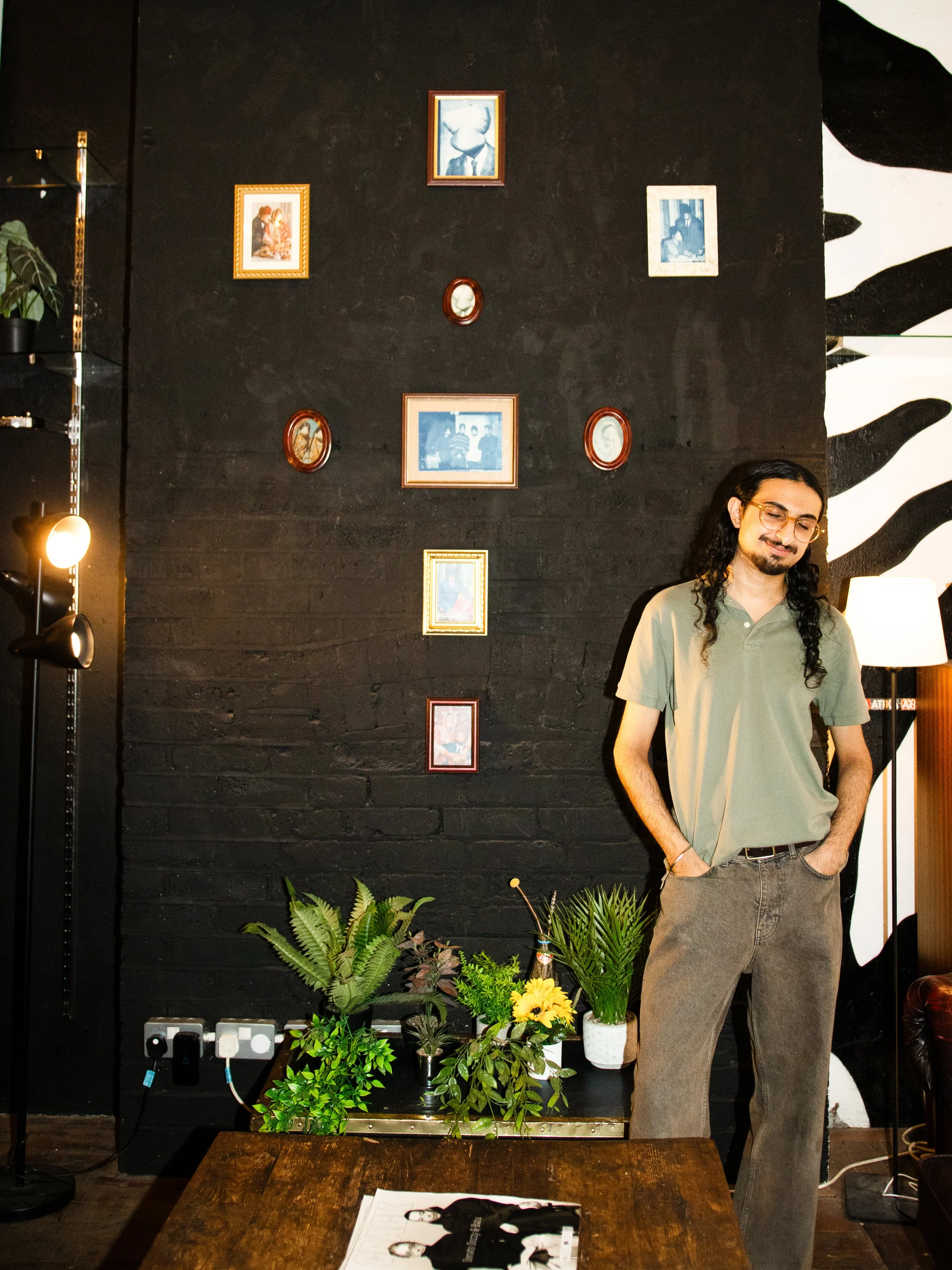Featured artist standing beside their artwork at ATIKA Art Space London