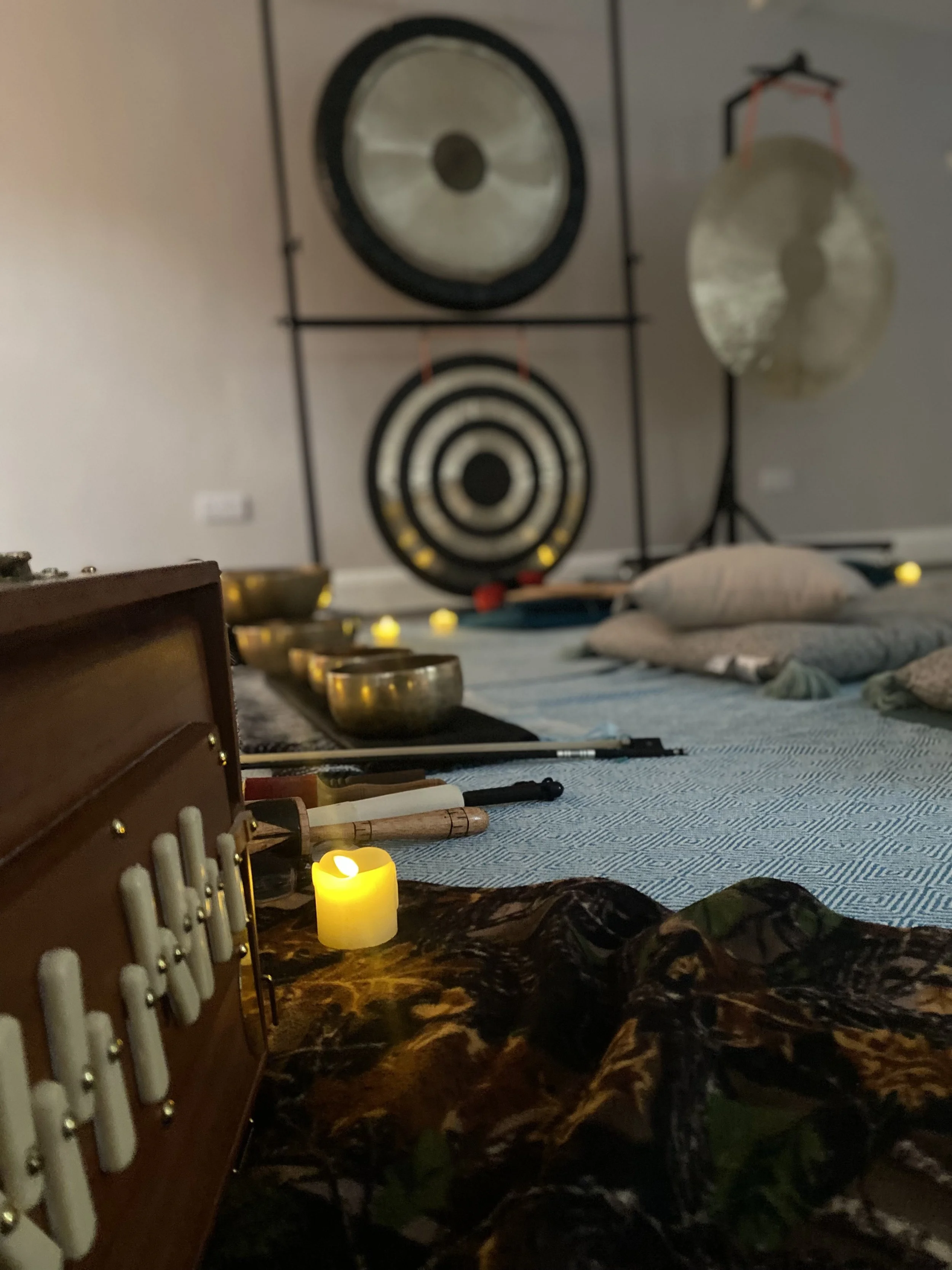 sound bath instruments with candlelight, mats and gongs for private sound bath in the peak district