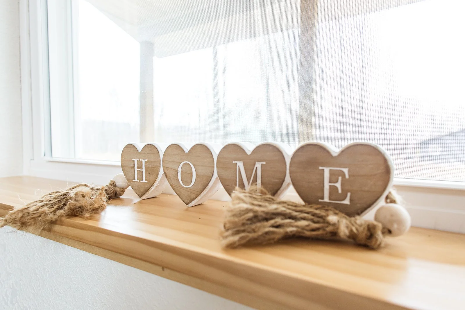 Black and white illustration of a seated person playing a violin.