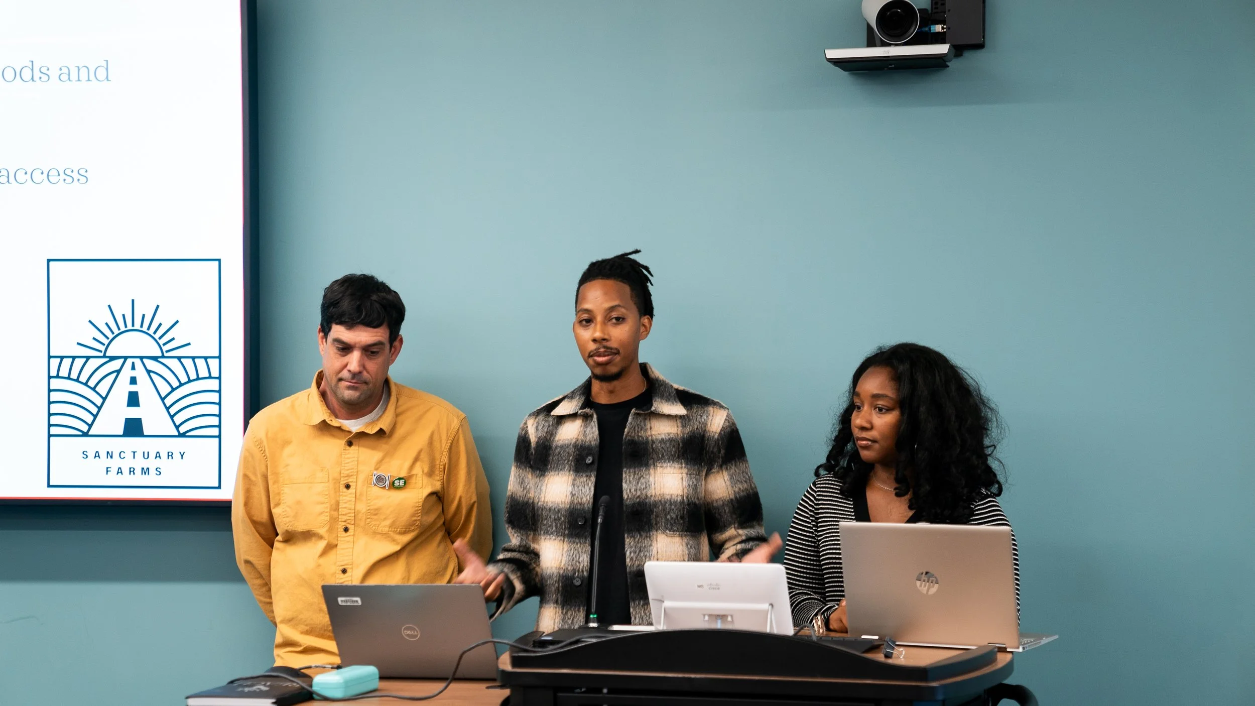 Three presenters at the REACH meeting
