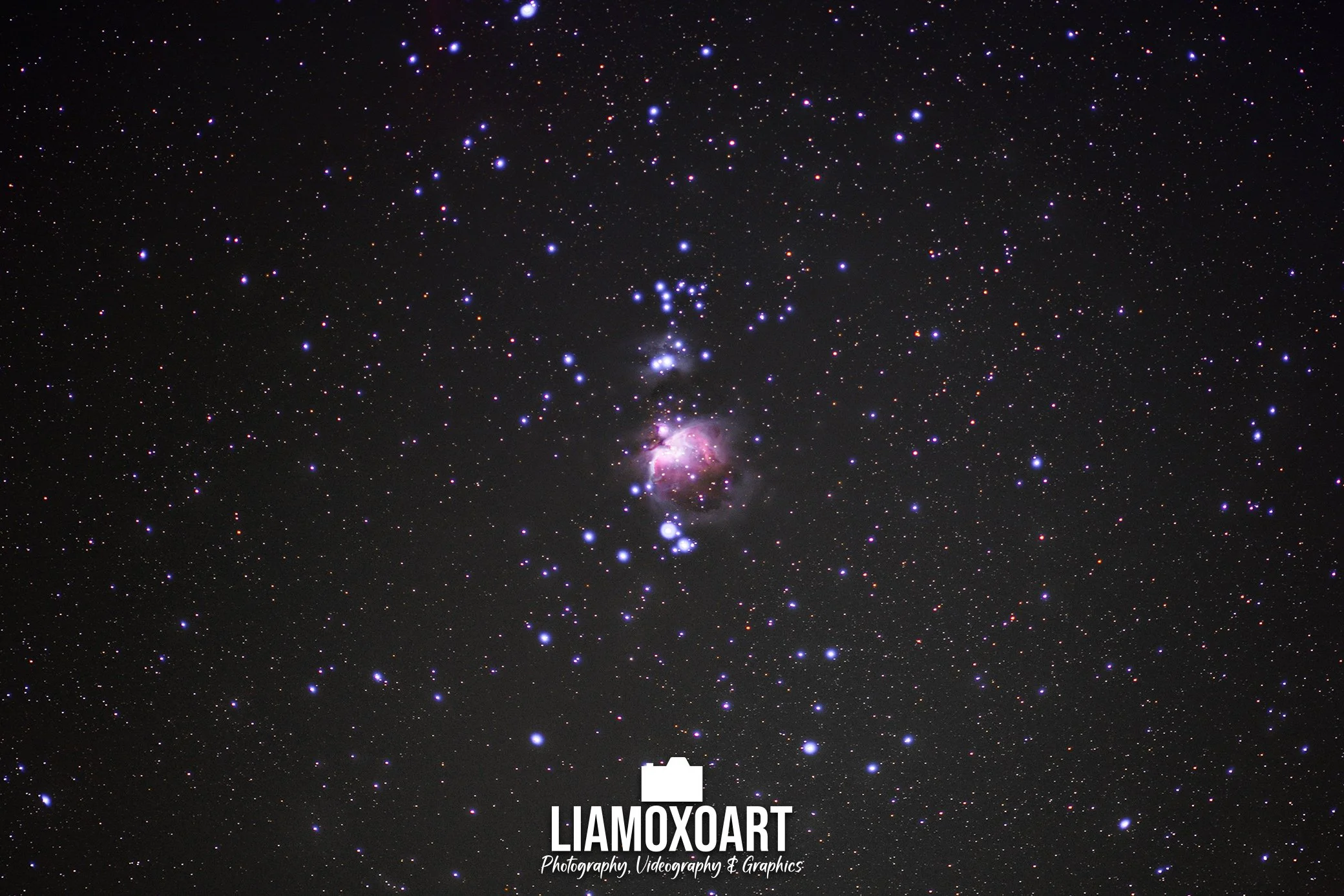 A night sky filled with countless stars and a nebula, with a logo and text at the bottom that reads 'LIAMOXART. Photography, Videography & Graphics.'