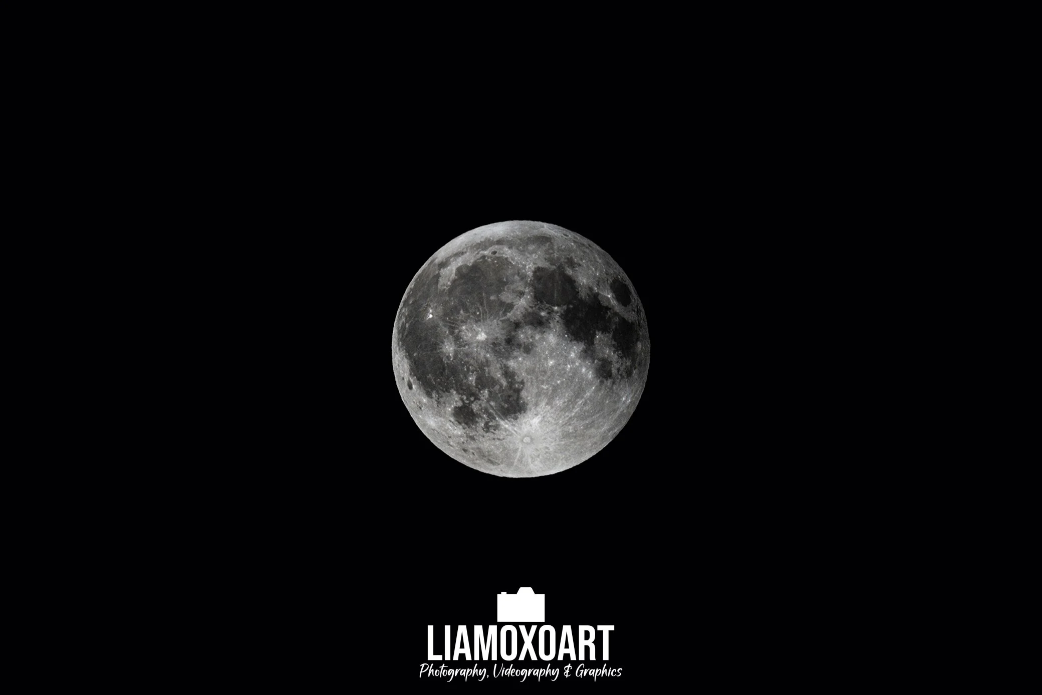 A detailed photograph of the moon against a black background, with a logo and text at the bottom reading 'LIAMOXOART Photography, Videography & Graphics'.