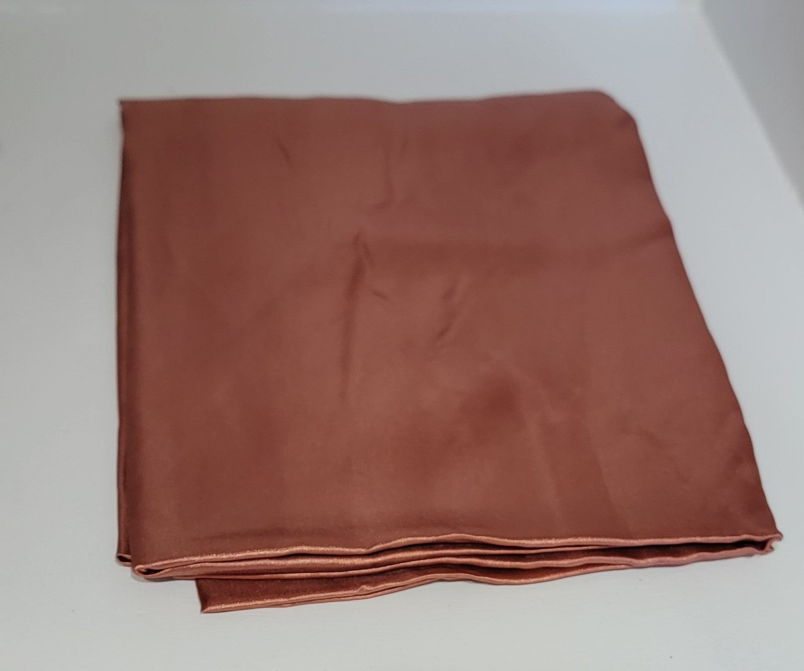 Terracotta Satin Rectangular Tablecloth •
60" x 126" •
Quantity in Stock: 10