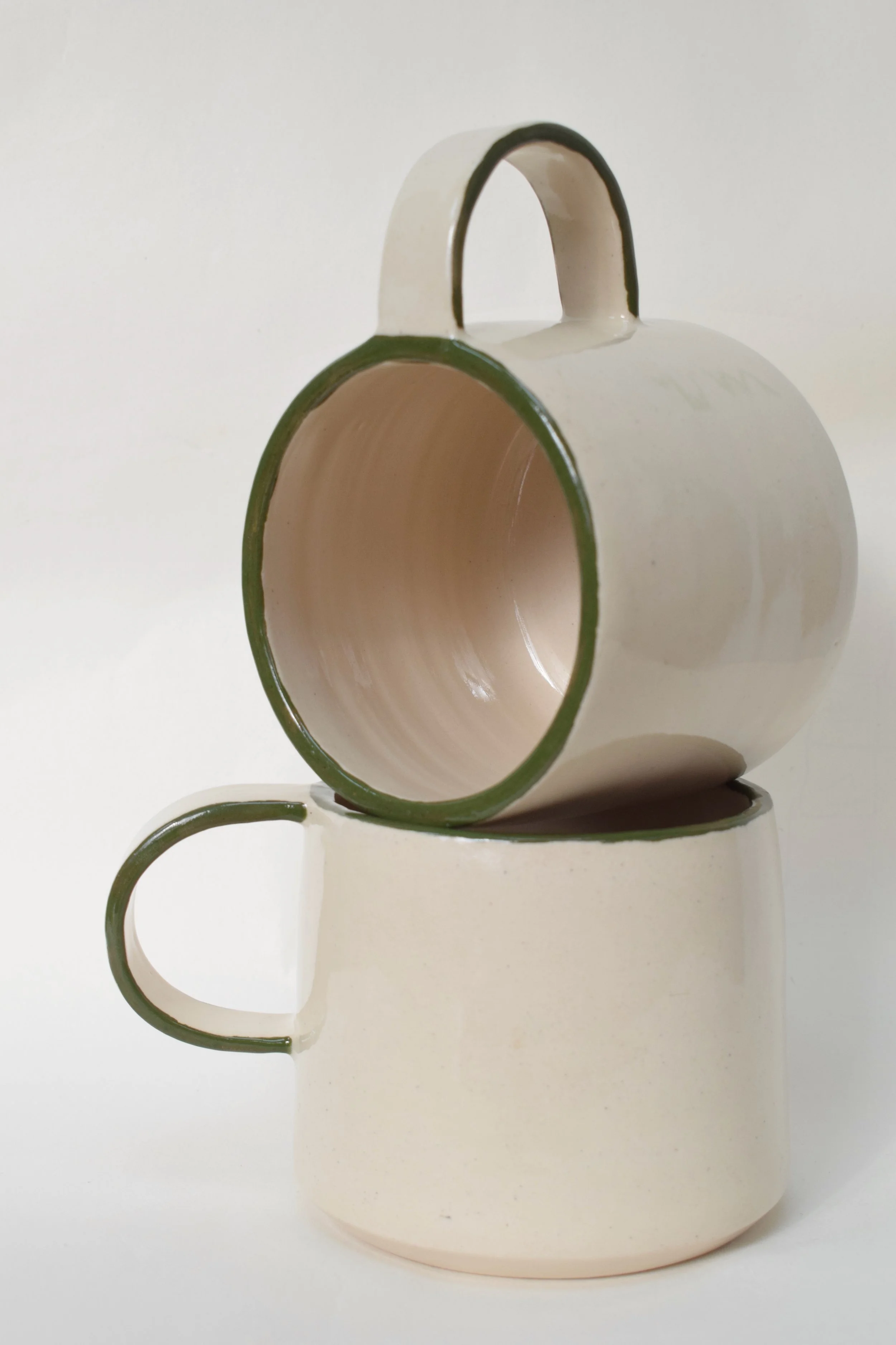 J Lucas Pottery_green edge mugs_stacked_right angles.jpeg
