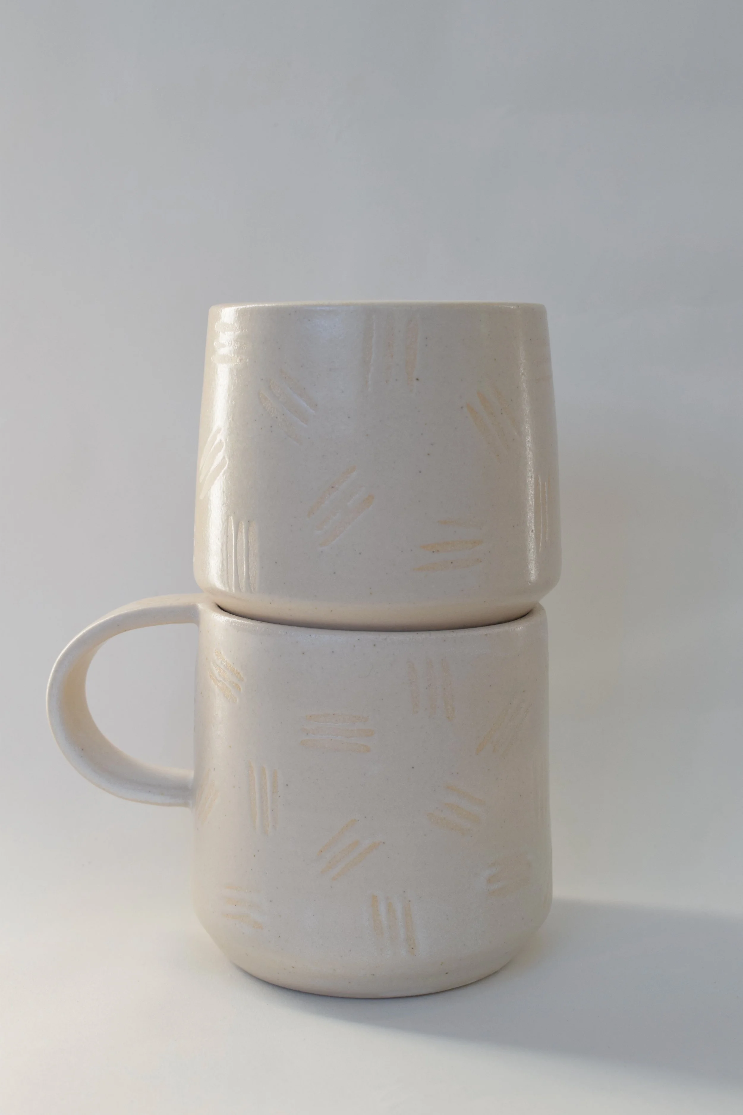 J Lucas Pottery_cotton dash mug and cup_stacked.jpeg