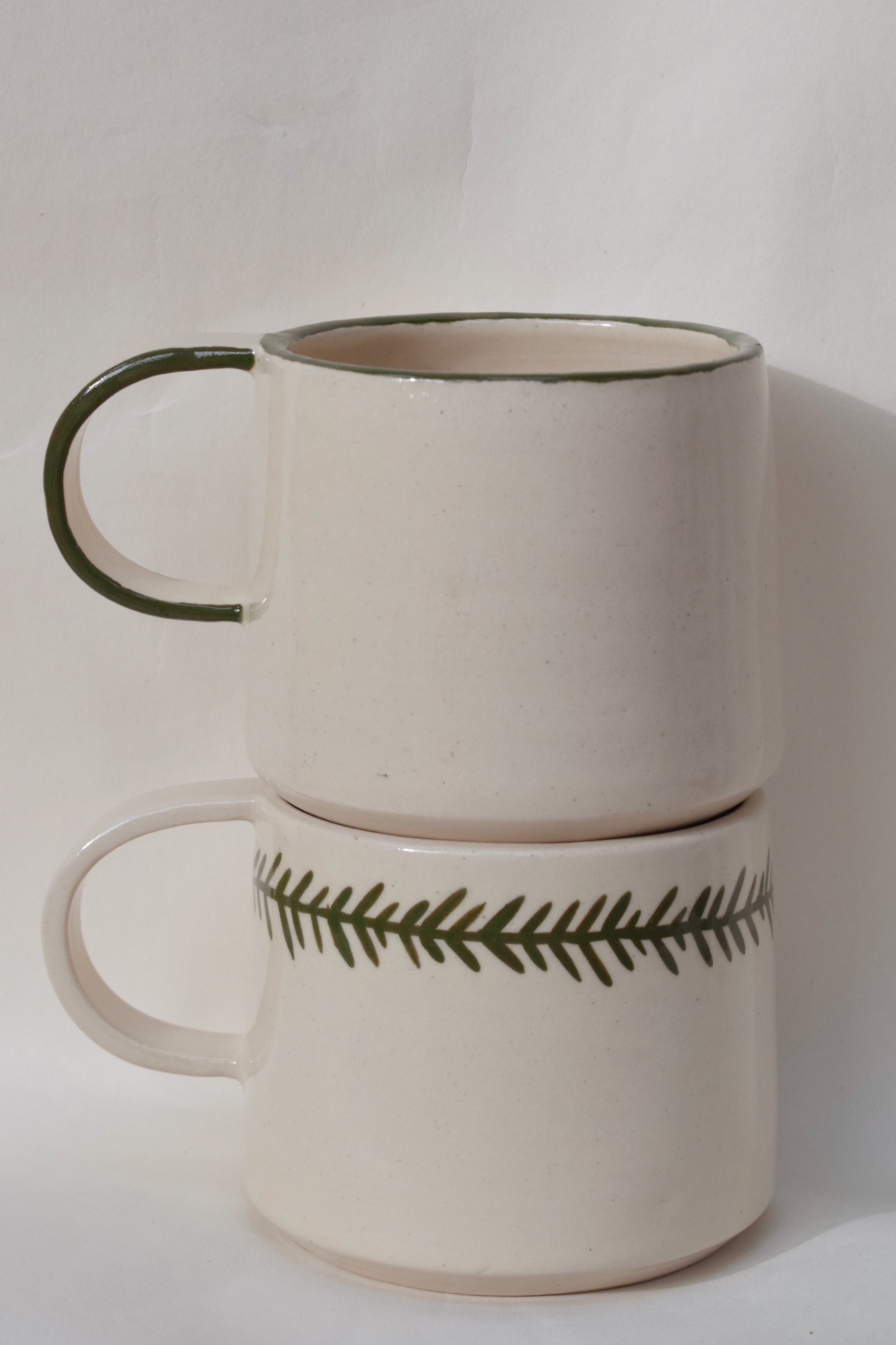 J Lucas Pottery_frond and edge mugs_stacked.jpeg